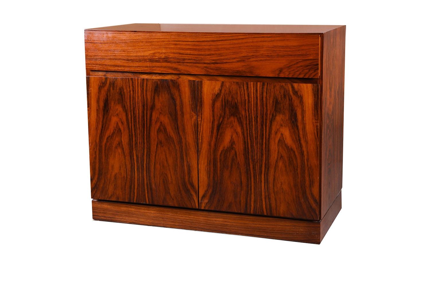 A beautiful Danish modern, Model #127 two-door rosewood credenza circa 1960’s, designed by Arne Wahl Iversen and produced in Denmark by Vinde Mobelfabrik. This piece is an exceptional craftsmanship with beautiful interior, construction is