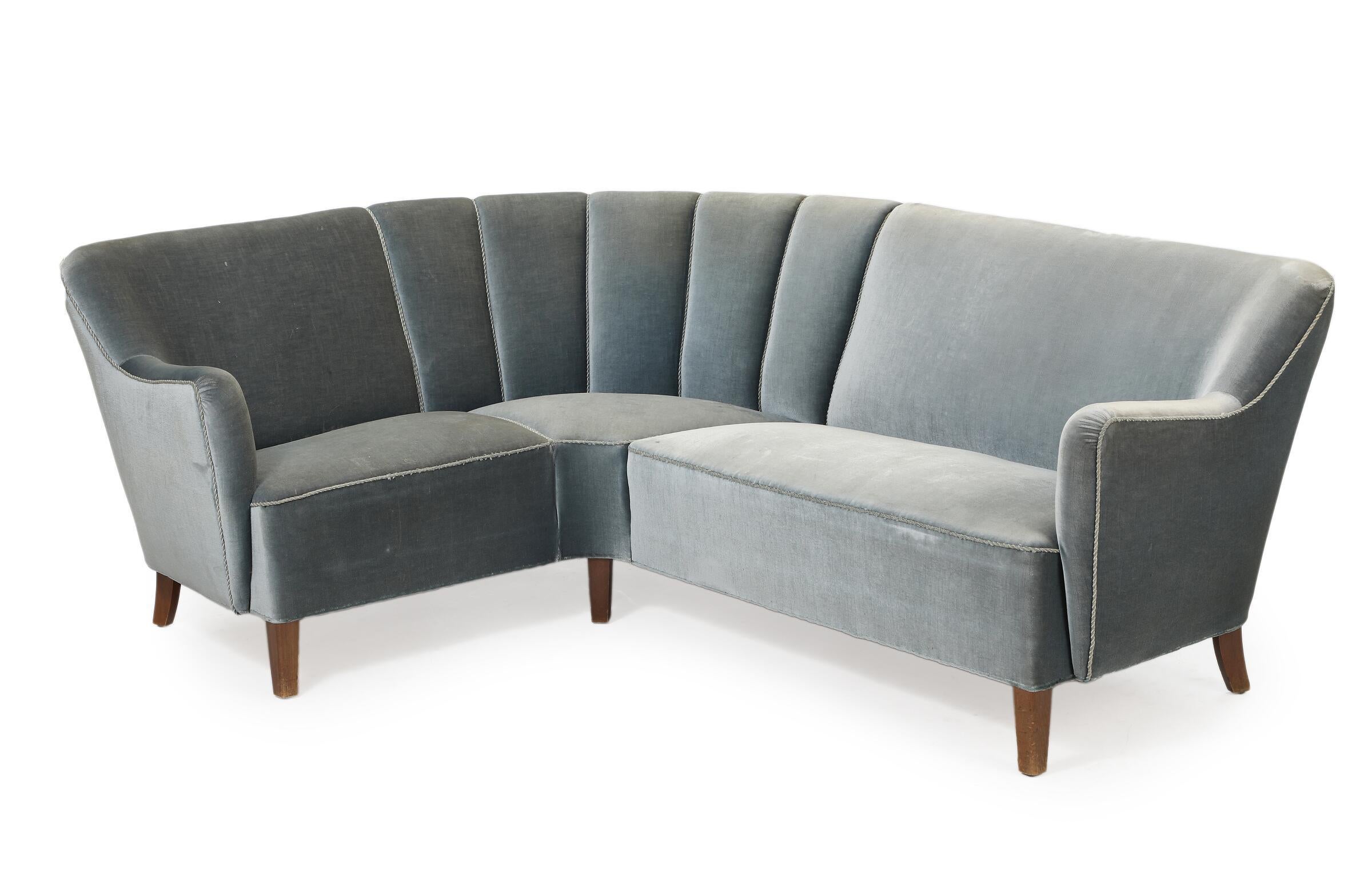 Rare early mid-century Danish 2-piece sectional corner sofa. This sofa was made even before sectional sofas became a thing with excellent proportions and overall form, lending support and comfort while becoming an absolute statement piece. Raised on
