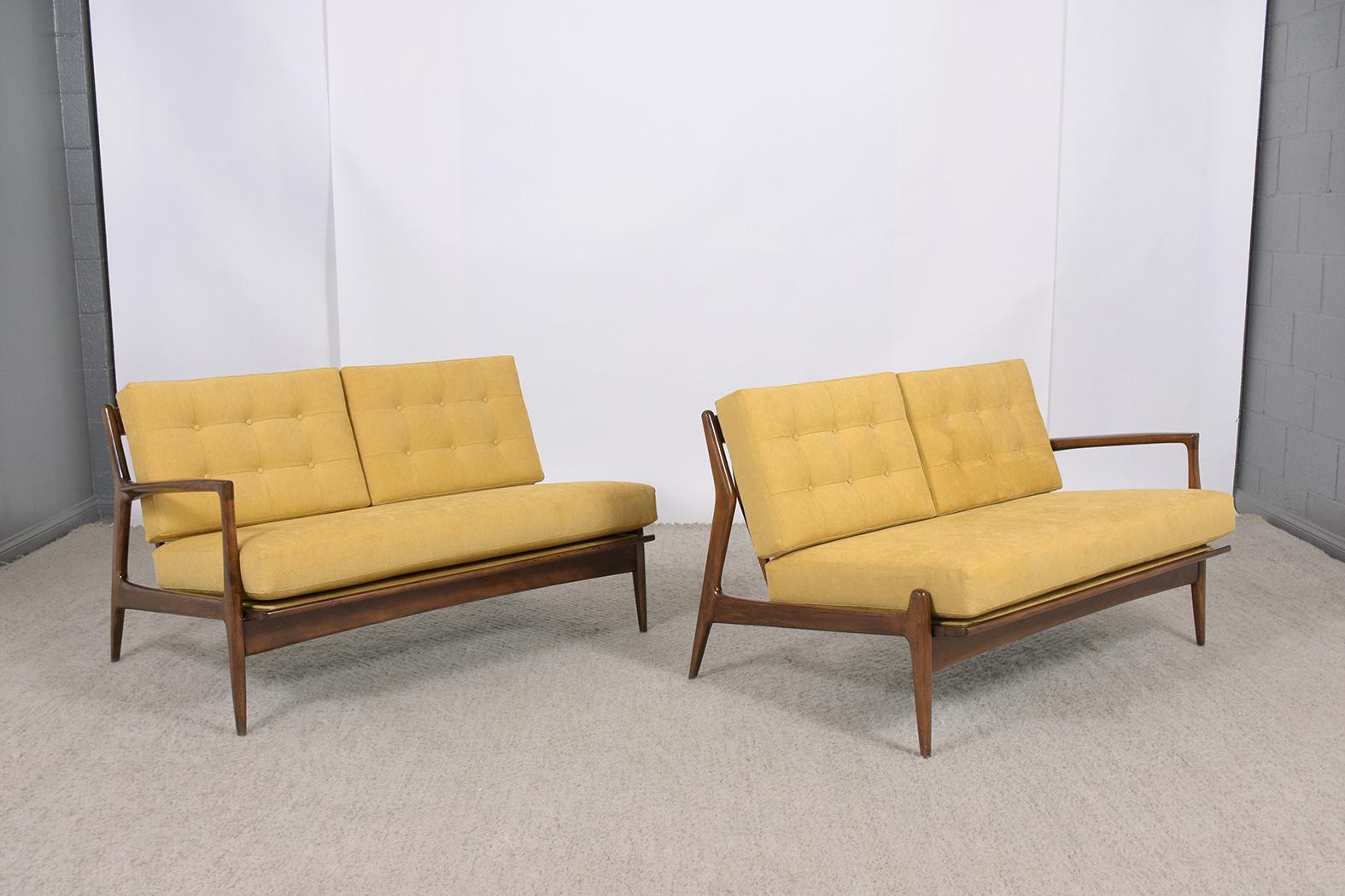 Step into the world of 1960s Scandinavian design with our extraordinary mid-century modern Danish sectional sofa. This vintage sofa, expertly handcrafted from teak wood, stands as a testament to the era's unmatched craftsmanship and style. Our