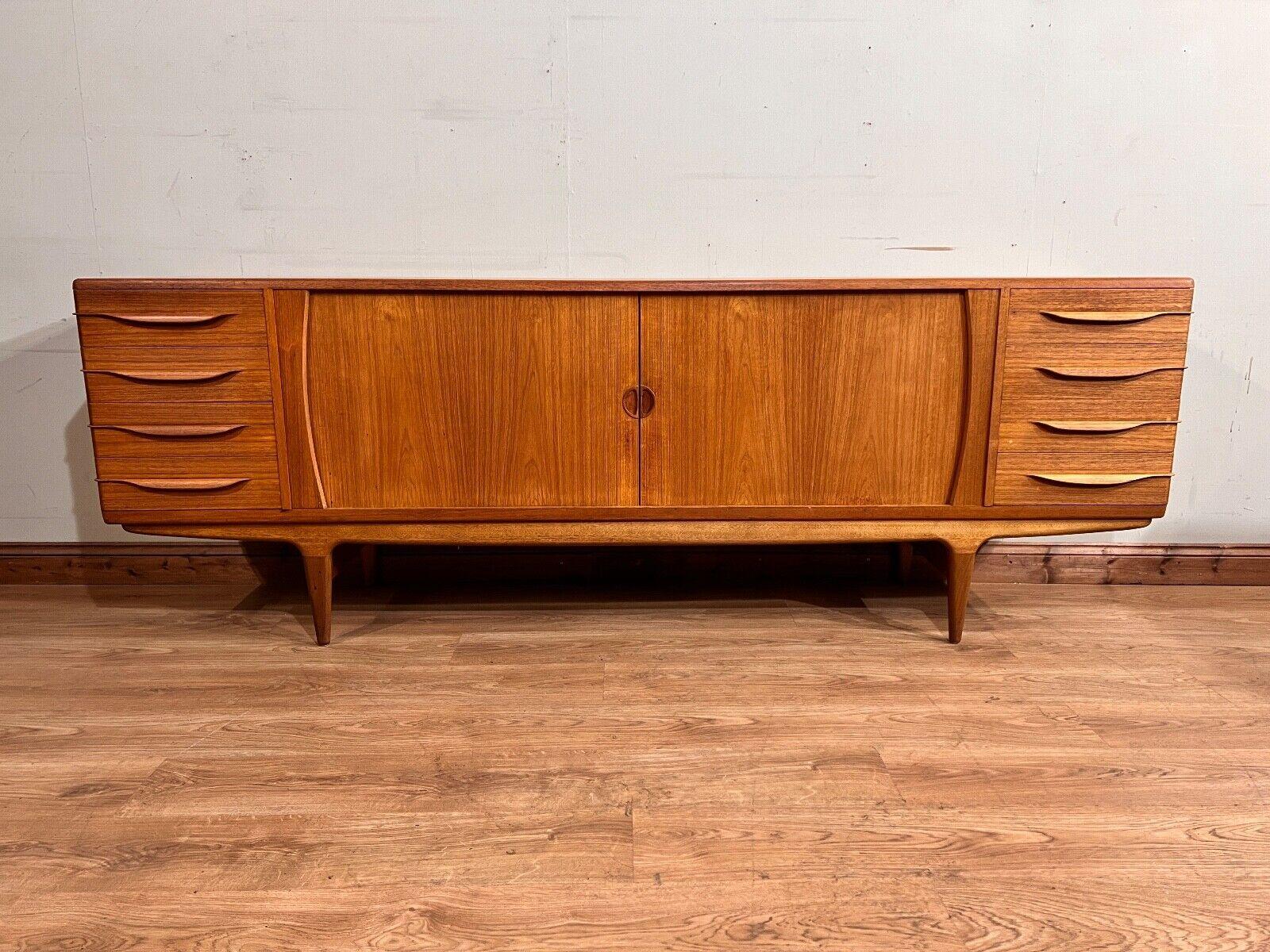 Rare and large Mid Century Danish sideboard
Circa 1960s on this piece by Johannes Anderson
Clean and minimal design perfect for modern interiors
Hand crafted from teak
Johannes Anderson's Scandinavian style was well known for distinctive shaping,