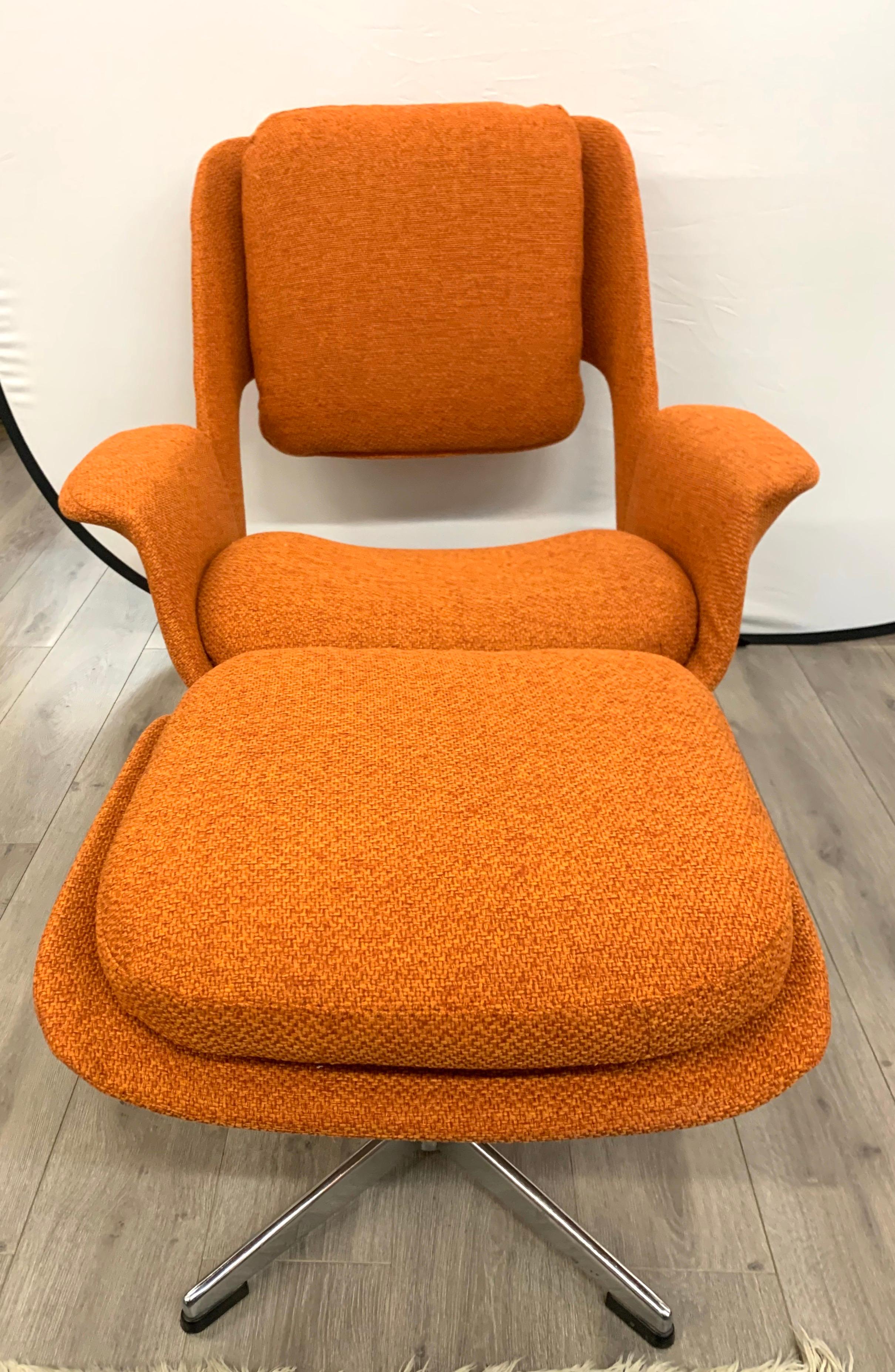 Magnificent Stendig midcentury swivel chair and ottoman set that has been just reupholstered in a Hermes orange colored fabric. The ottoman's dimensions are 22 x 19 x 17 tall and the chairs dimensions are below. Condition is mint. Lovely scale and