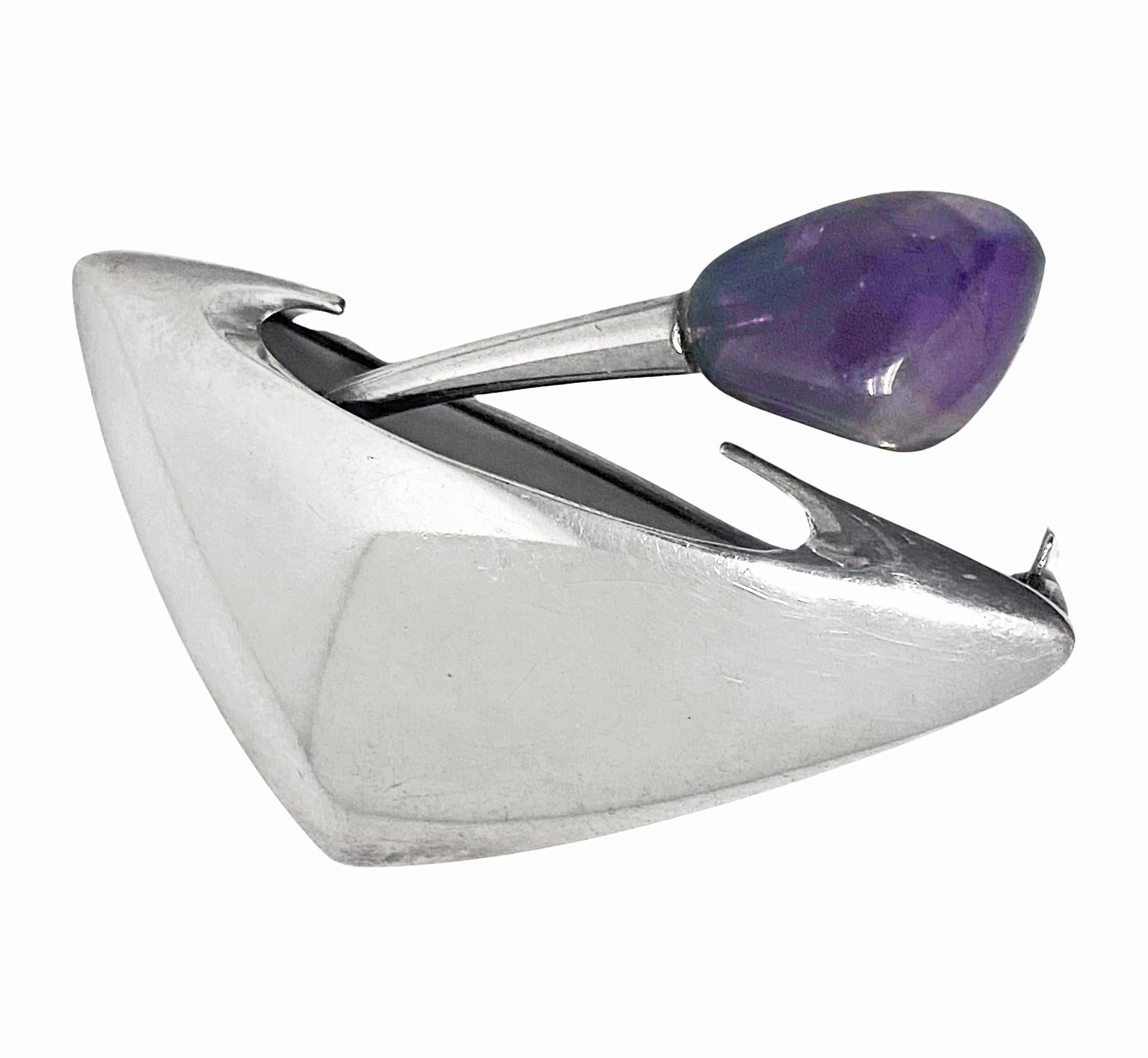 Mid century Danish Sterling N.E. From unusual pin Brooch. In an elliptical form of an amethyst `flower petal sprouting' from a plant pot. Measures approximately 2.10 x 1.6 inches. Item Weight: 13.91 grams. Marked Sterling Denmark 925S N.E. From