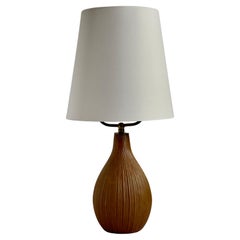 Mid century danish stoneware table lamp in earthy color and with brass top lid.