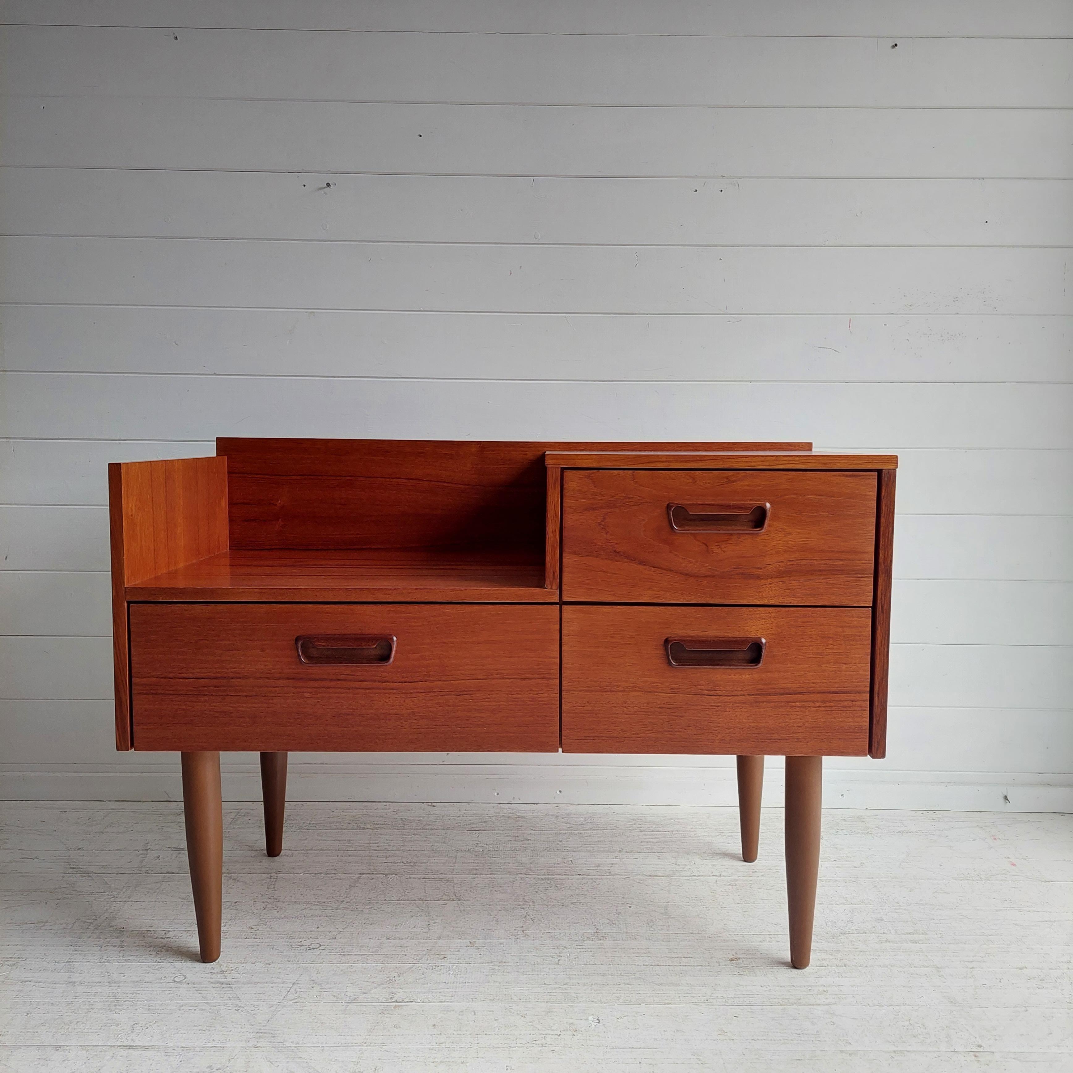 This Danish teak storage piece is clearly a prize, for more reasons than one.

We think this mid century beauty is by Munch Slagelse Mobler.
From the late sixties, early seventies. 
Nice sleek design. 
The maker can be deduced from the shape of the