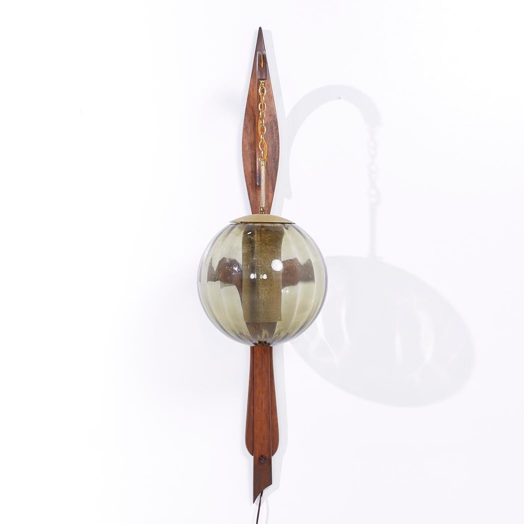 Mid Century Danish Teak and Glass Wall Mount Lamp

This lamp measures: 11.5 wide x 15 deep x 47 inches high

We take our photos in a controlled lighting studio to show as much detail as possible. We do not photoshop out blemishes. 

We keep you