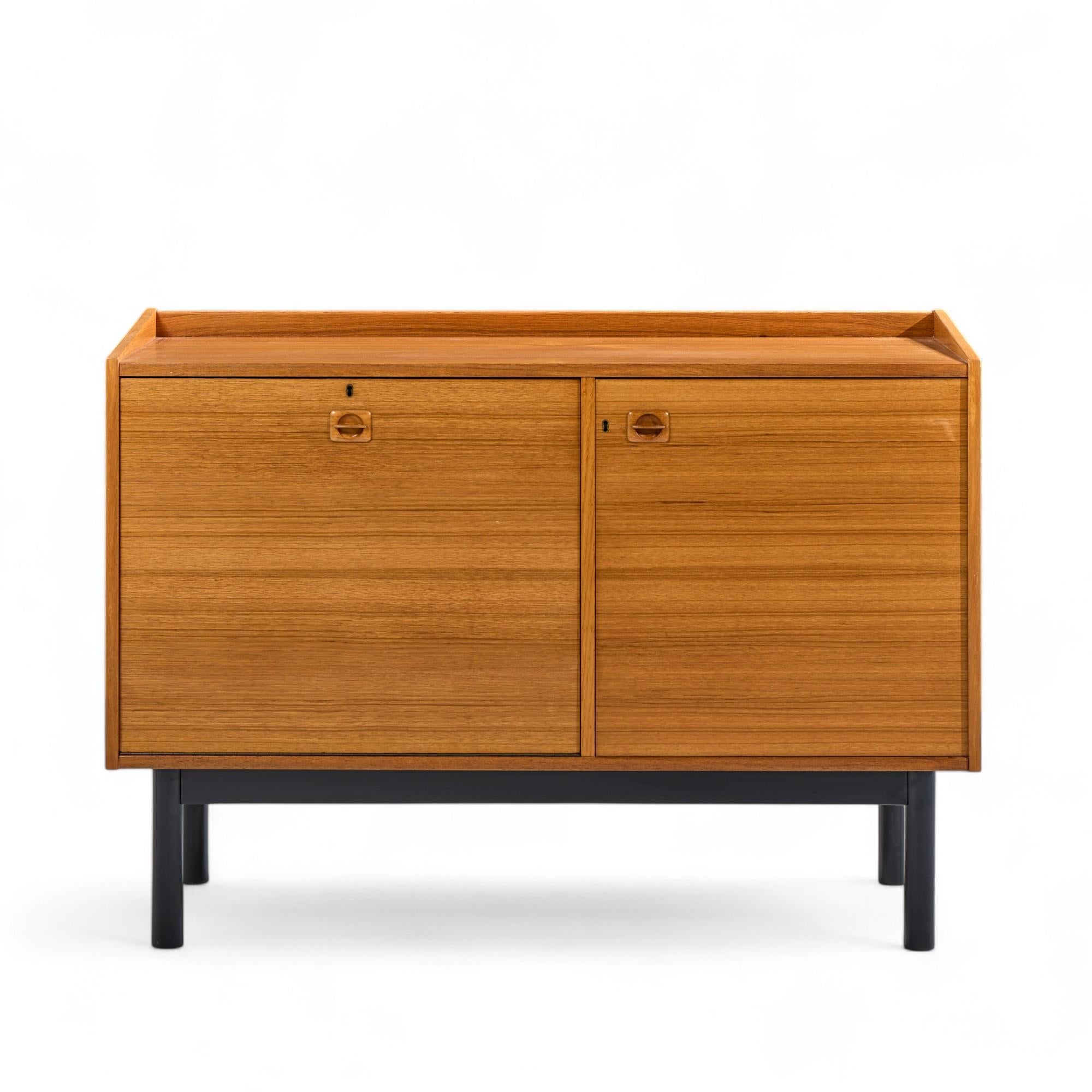 Mid Century Danish Teak Bar Cabinet

This bar cabinet measures: 49 wide x 20 deep x 36 inches high

All pieces of furniture can be had in what we call restored vintage condition. That means the piece is restored upon purchase so it’s free of