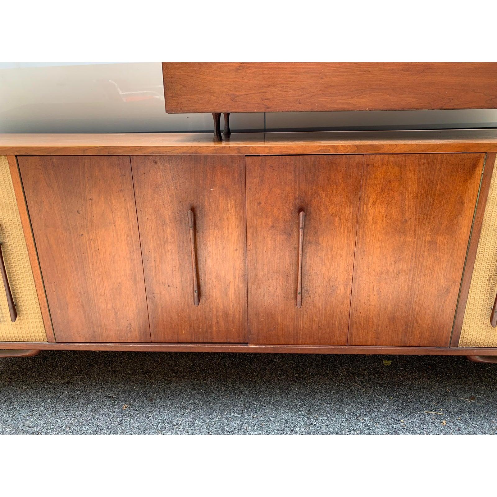 Mid century Danish teak bar & entertainment center. This is a great unique piece and is still in working order. Top piece does come off and can be used separate if wanted.
