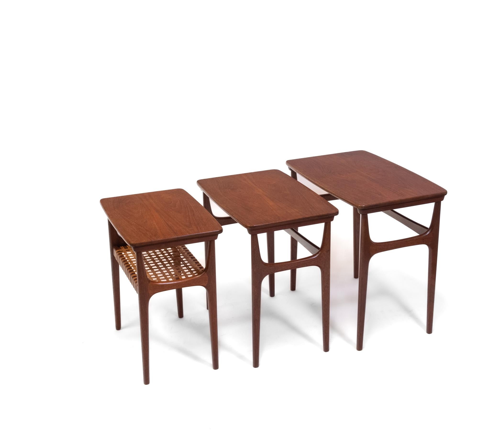 Scandinavian set of three teak and cane nesting tables by Heltborg Møbler – Danish - Circa 1950's. Stamped.

The tables are in very good clean condition, with no damage. There are some marks to the table tops with some light indentations, and a few