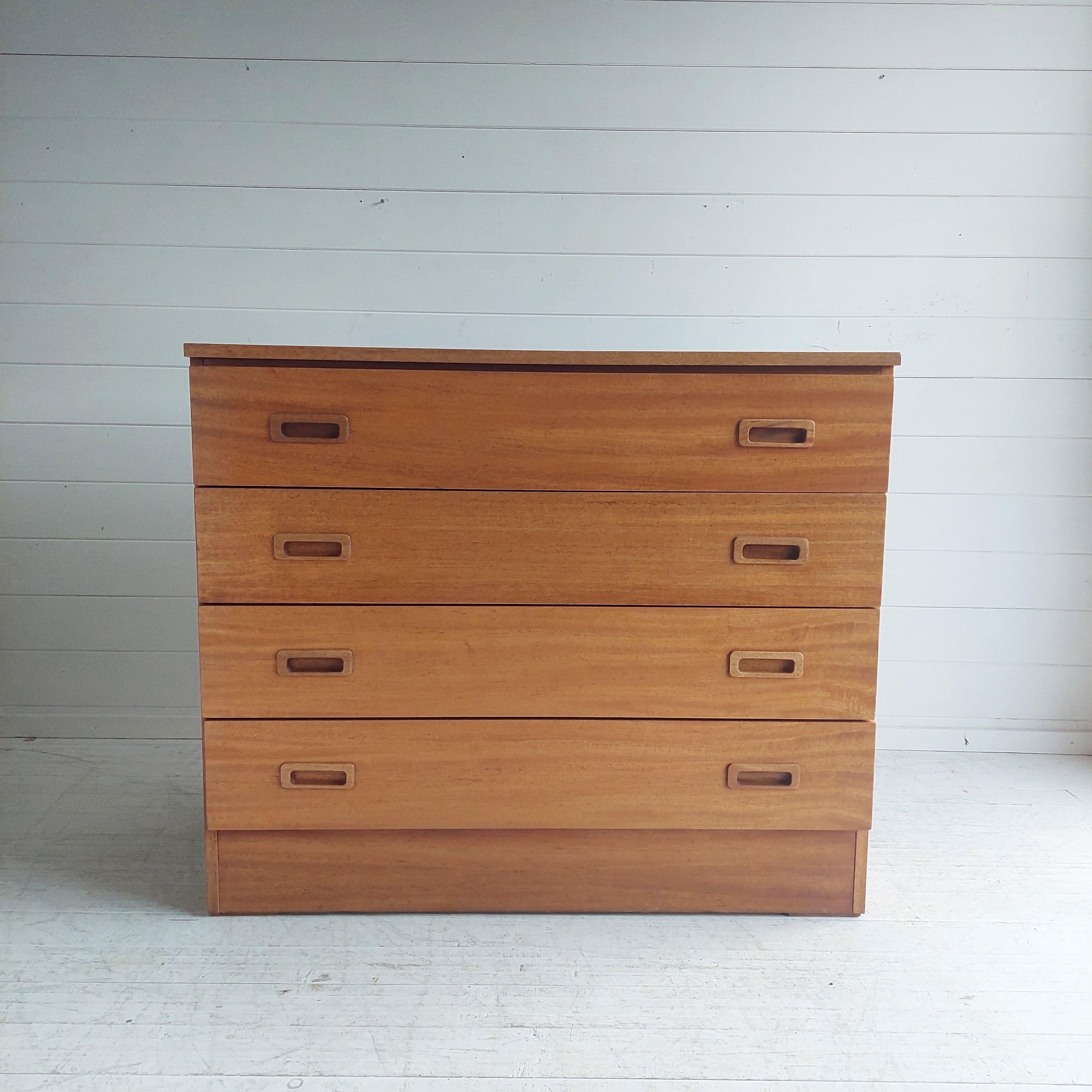 Stylish teak design chest of drawers. 
The chest of drawers comes from Denmark 
Designed in the style of Poul Hundevad. 
The cabinet has beautiful handles and 4 handy drawers and lovely gold tone.
Design Period 1960 to 1969

Mid-Century Danish