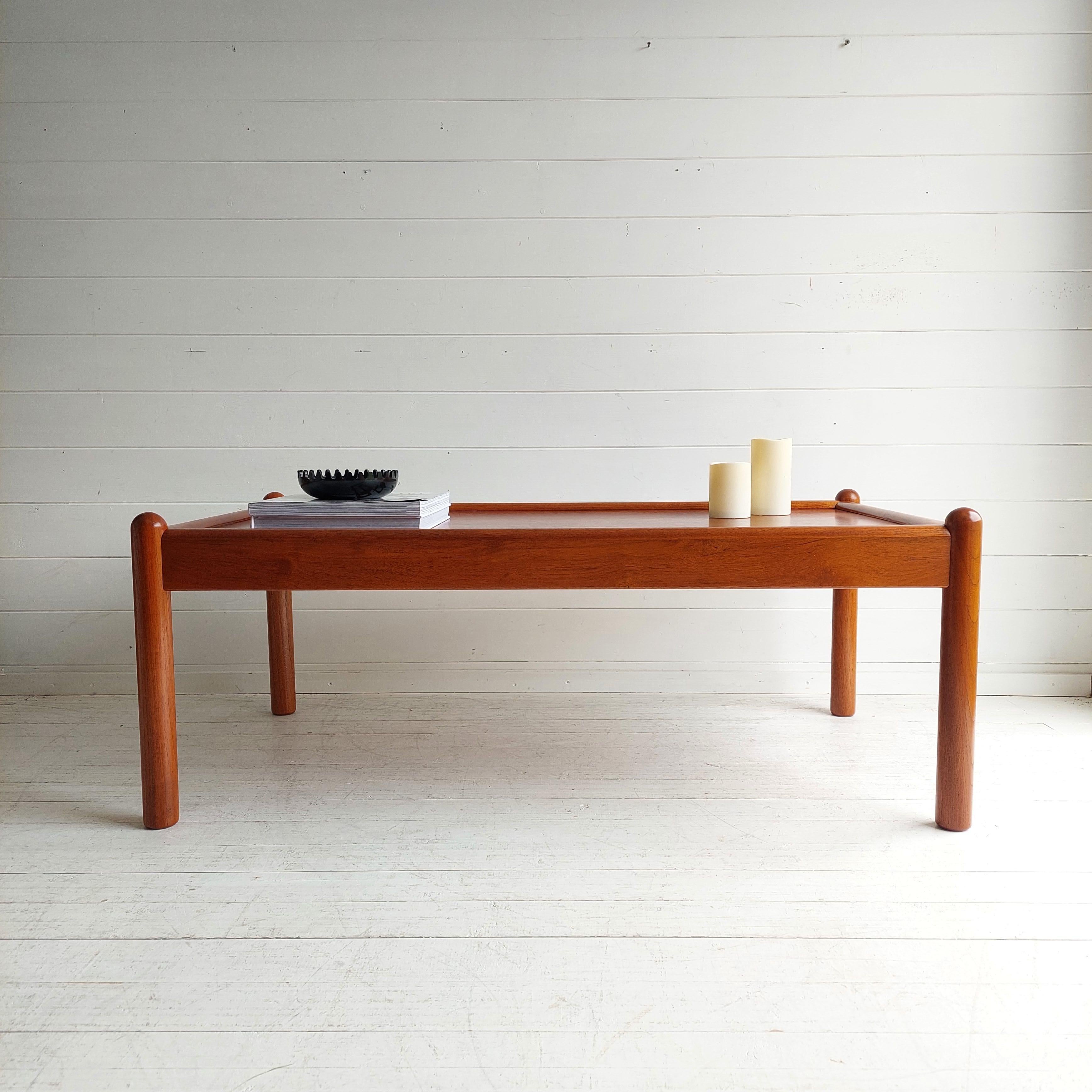 An original and beautifully designed mid coffee table in teak. 
Designed and produced in Denmark by Domino Mobler. 
Scandinavian teak coffee table, rectangle, from the 1960's 70s
 
We love the design, size and colour. 
A table that is very useable
