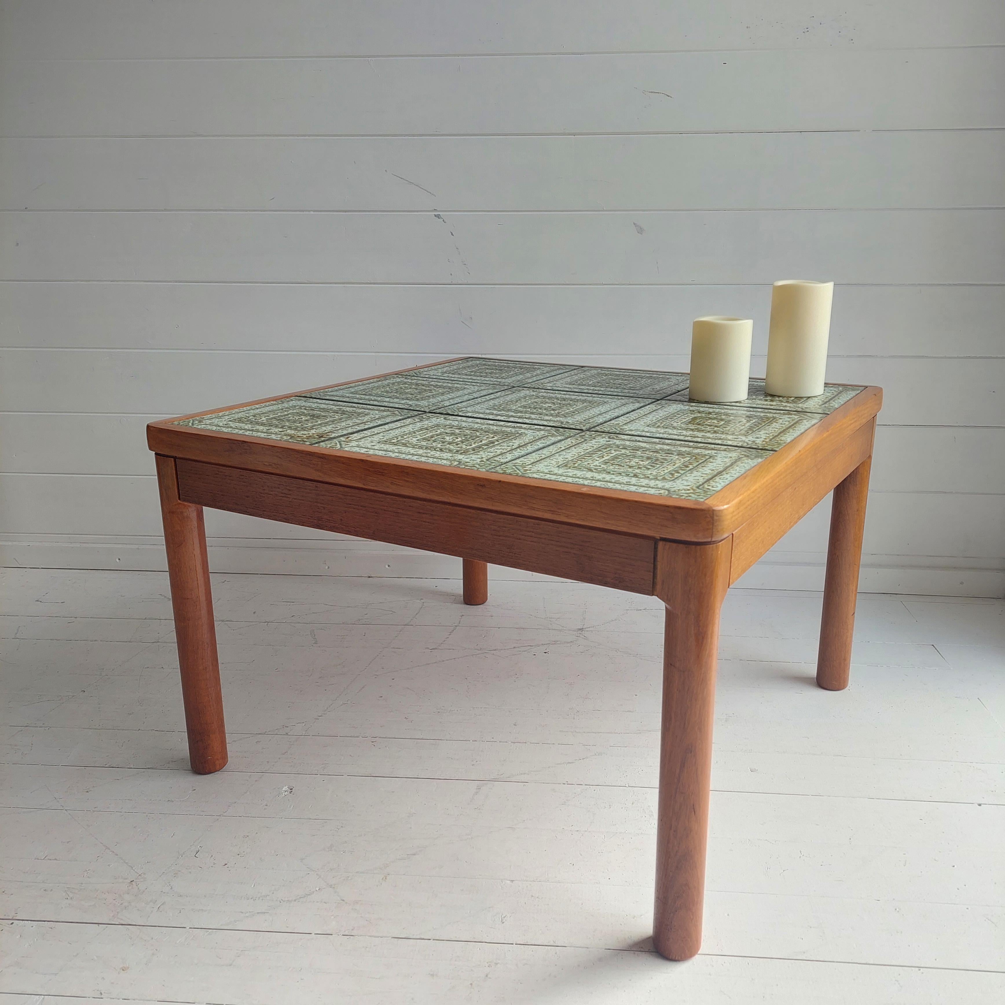 Rare and original Danish coffee table by the renowned brand of Trioh. 
Teak framed table with 9 tiles on its top.

This features stylish set of green patterned tiles and a teak veneer frame and legs. 
Very nice smooth teak grains complemented by