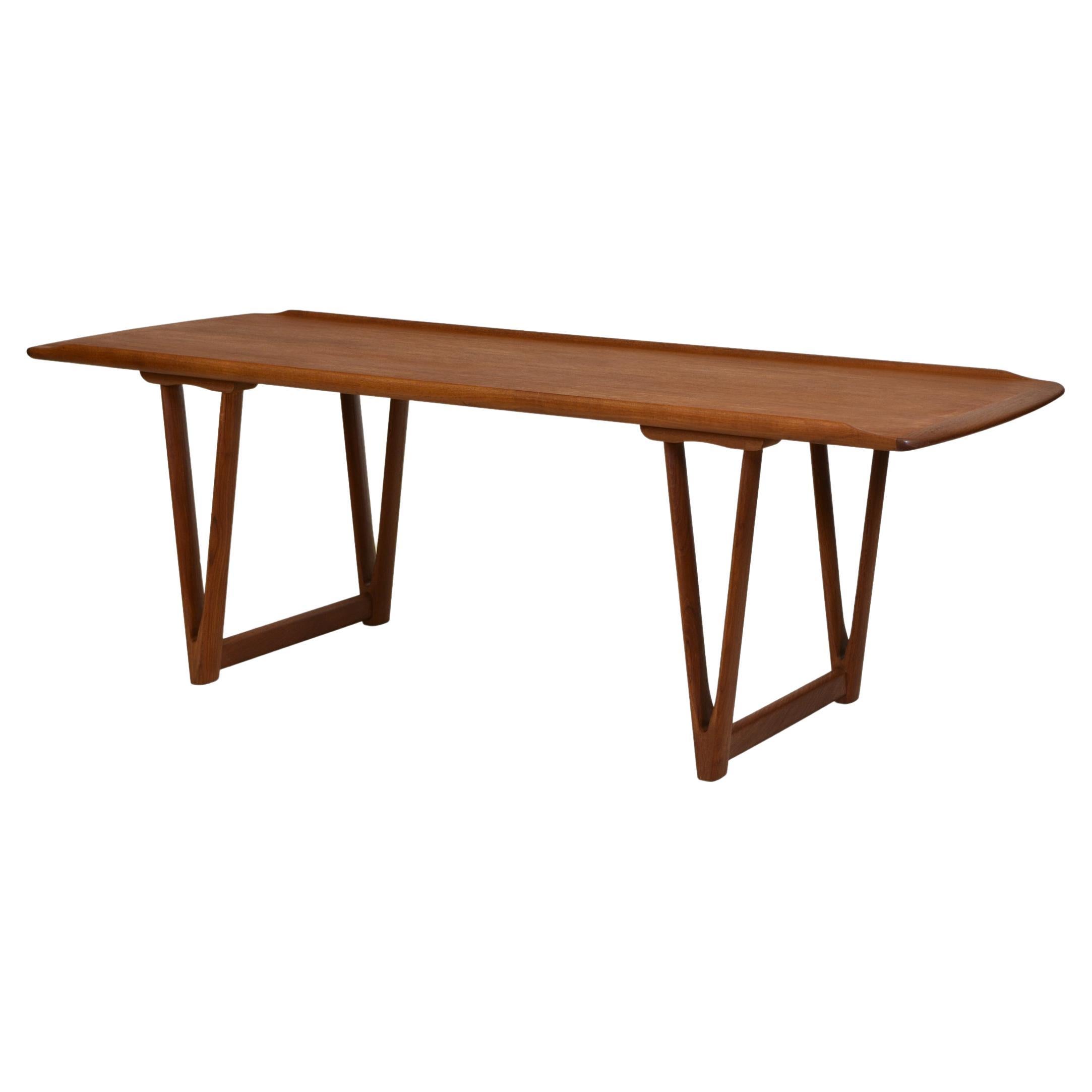 Mid Century Danish Teak Coffee Table on v Shape Supports and Lipped Top Edge For Sale