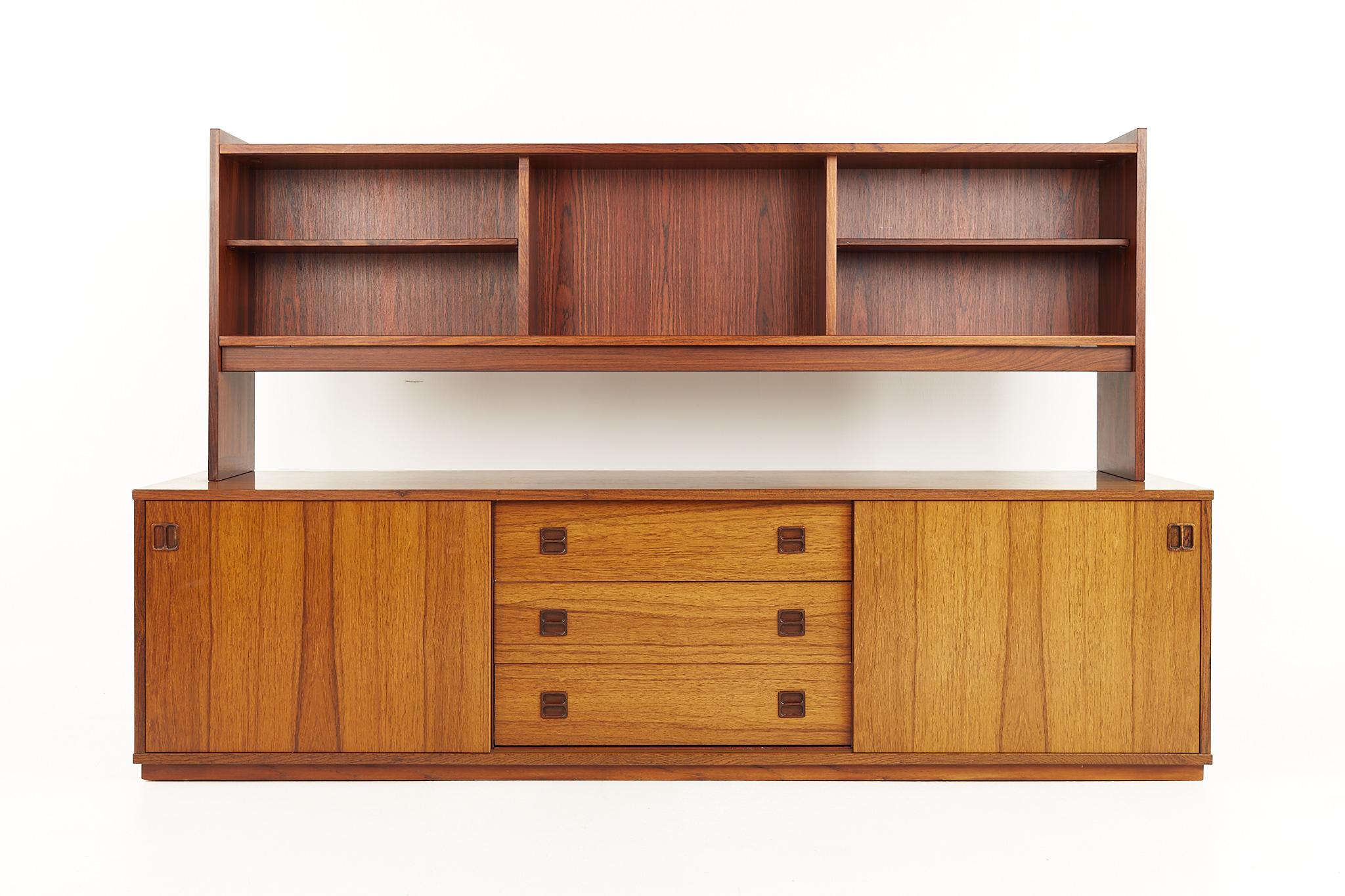 Mid century danish teak Credenza and Hutch

This credenza measures: 77.25 wide x 19.25 deep x 21.25 inches high

This hutch measures: 71 wide x 11.75 deep x 26.75 inches high, making a total height for both pieces 48 inches 

All pieces of