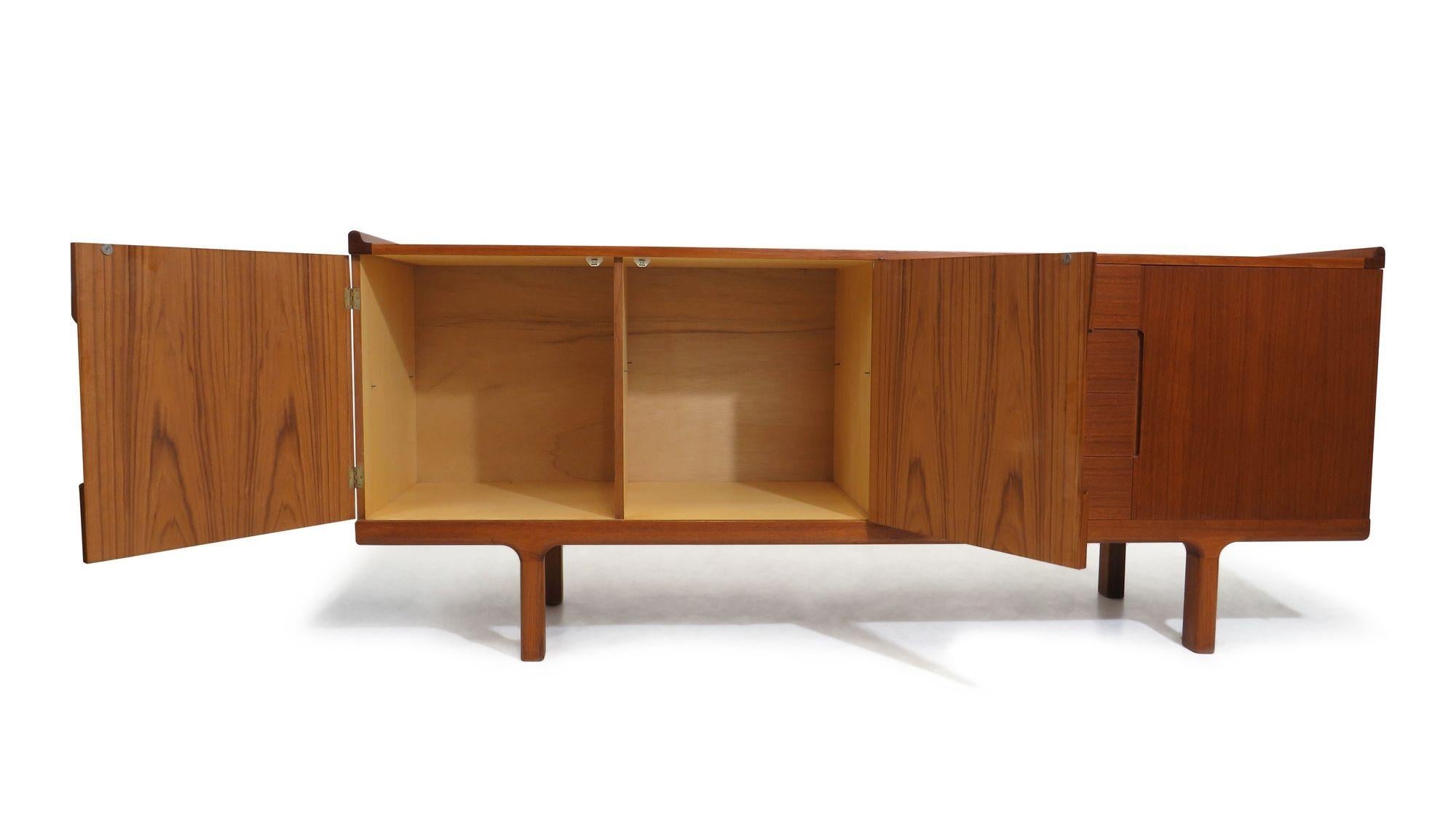 1960's Danish teak credenza crafted of teak with three doors and series of four drawers.
Perfectly restored in a natural oil finish, and in excellent condition.
Measurements
W 78.75'' x D 20.50'' x H 32.12''