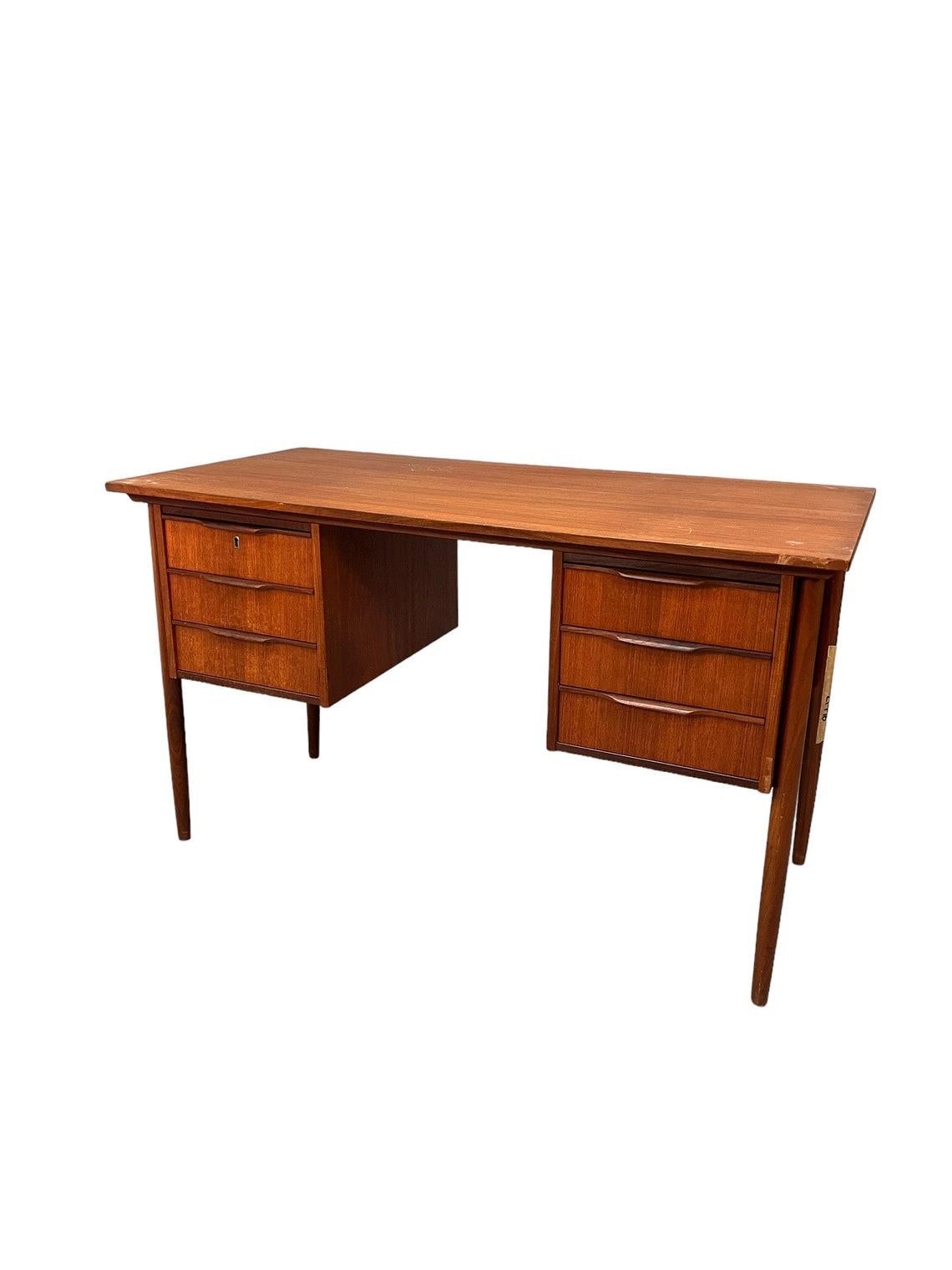 Mid-Century Danish teak desk 1960`s
Beautiful teak desk in classic 1960`s from Denmark

Dimensions:
L:48.5 D:23.5 H:29.5 inches 

Condition:
very good for age and use