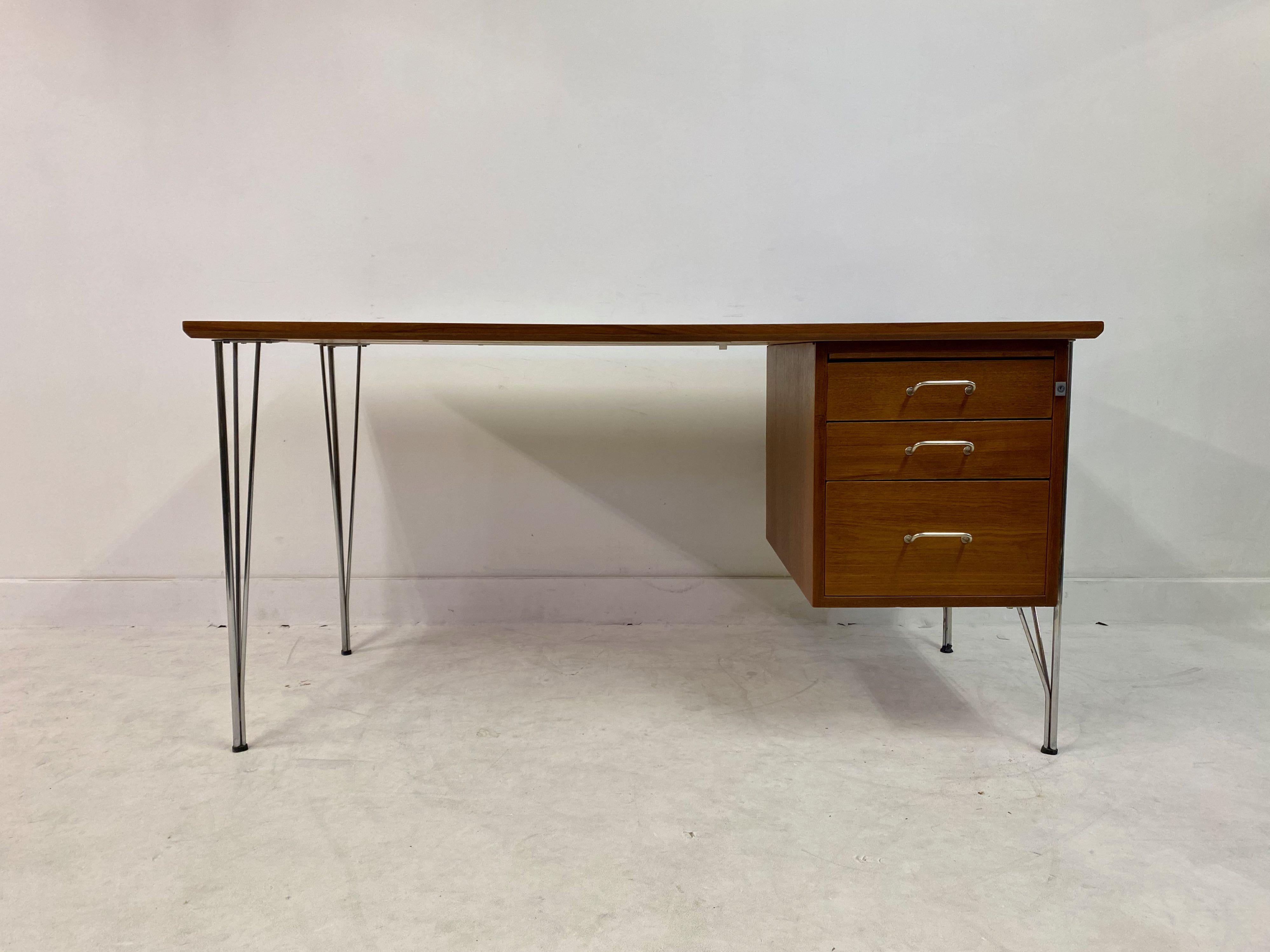 Teak desk

Three drawers

Chrome hairpin legs

Professionally restored

Denmark, 1960s-1970s.