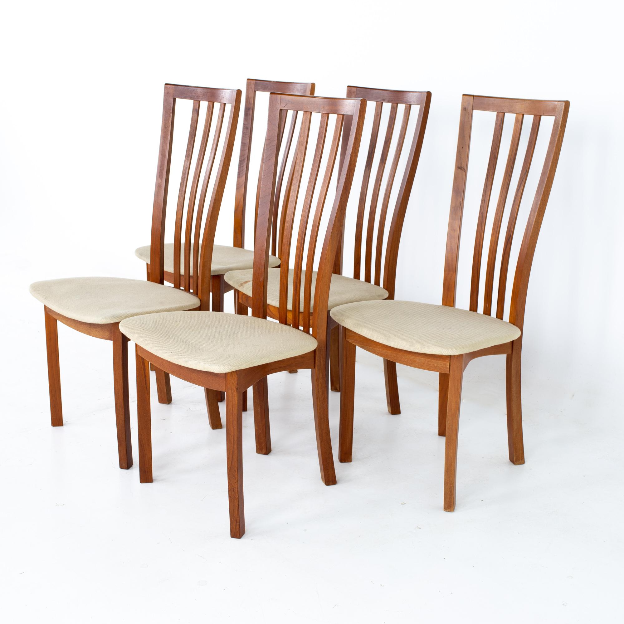 Mid century Danish teak dining chairs - Set of 5
Each chair measures: 19 wide x 21.25 deep x 41.75 high, with a seat height of 18.5 inches

All pieces of furniture can be had in what we call restored vintage condition. That means the piece is