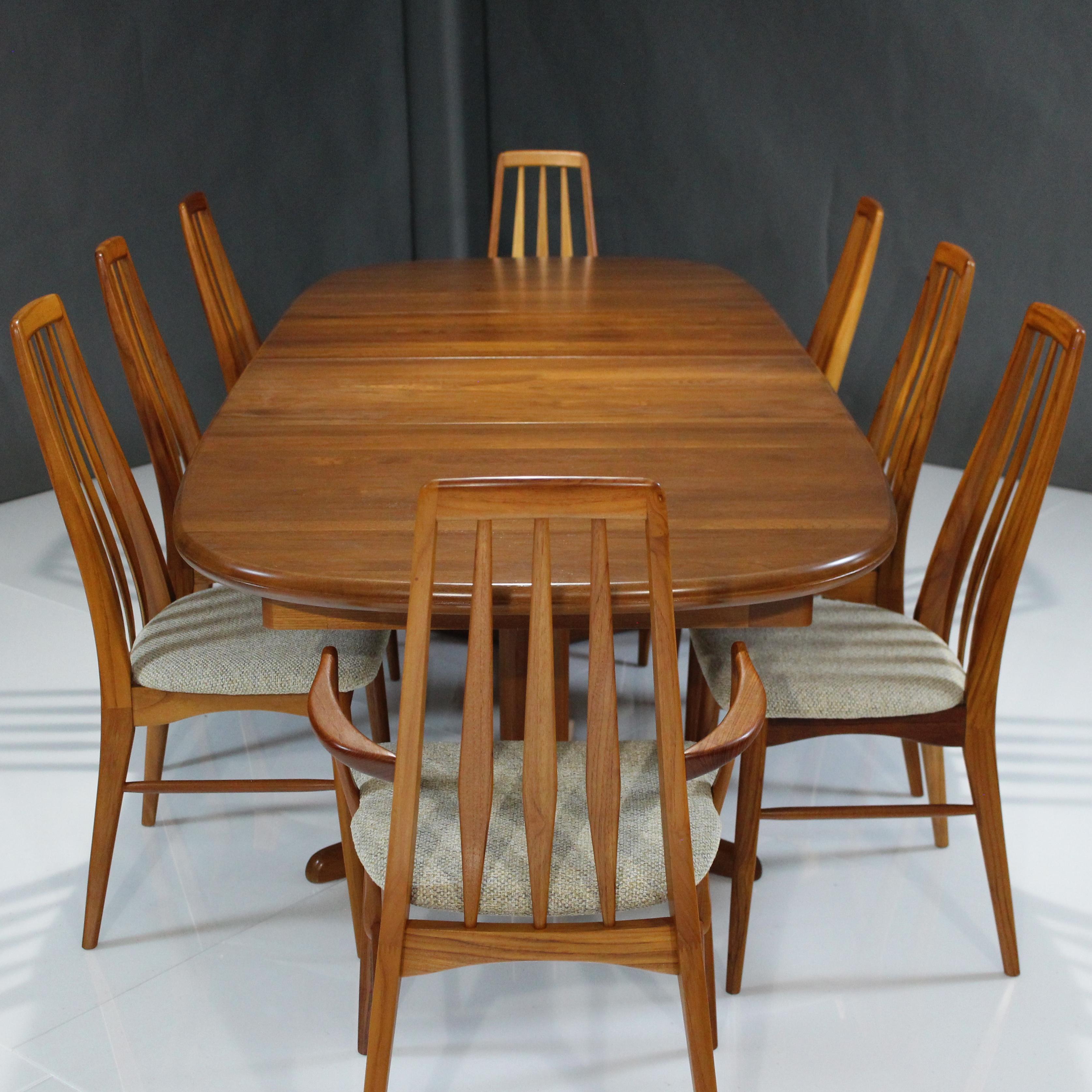 Presenting this absolutely stunning Danish Teak Dining Set with 8 chairs and Extension Table by Niels Koefoed.

About this set:
Starting off with 6 side chairs and 2 armchairs model ‘Eva’ Teak chairs by Niels Koefoed displaying elegant visuals