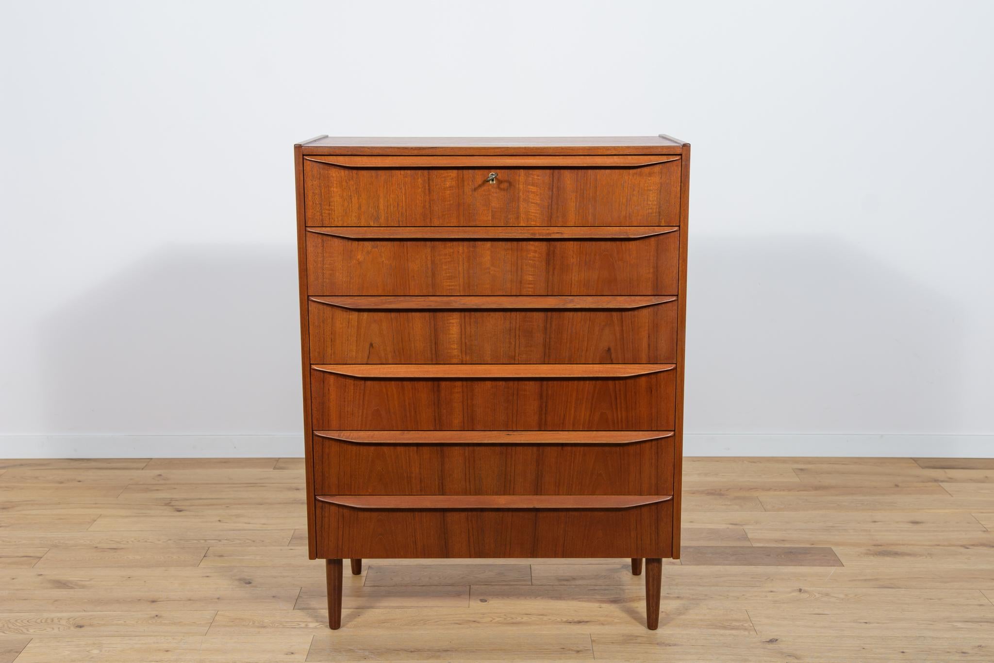 Teak dresser with six drawers made in the 1960s in Denmark. The dresser is a great example of the Danish Mid-Century style and is characterized by high quality of design and workmanship. The dresser has contoured handles. The dresser has undergone a