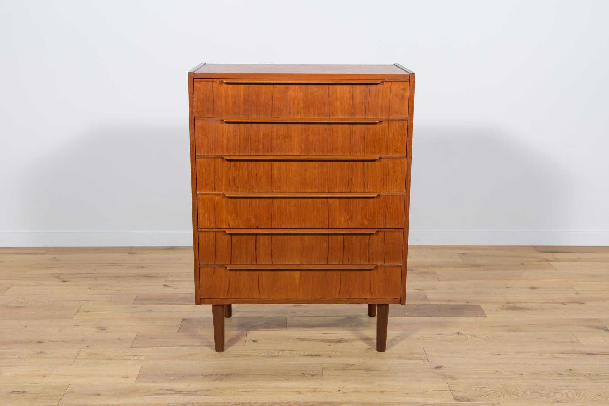 
Teak dresser with six drawers made in the 1960s in Denmark. The dresser is a great example of the Danish Mid-Century style and is characterized by high quality of design and workmanship. The dresser has contoured handles. The dresser has undergone