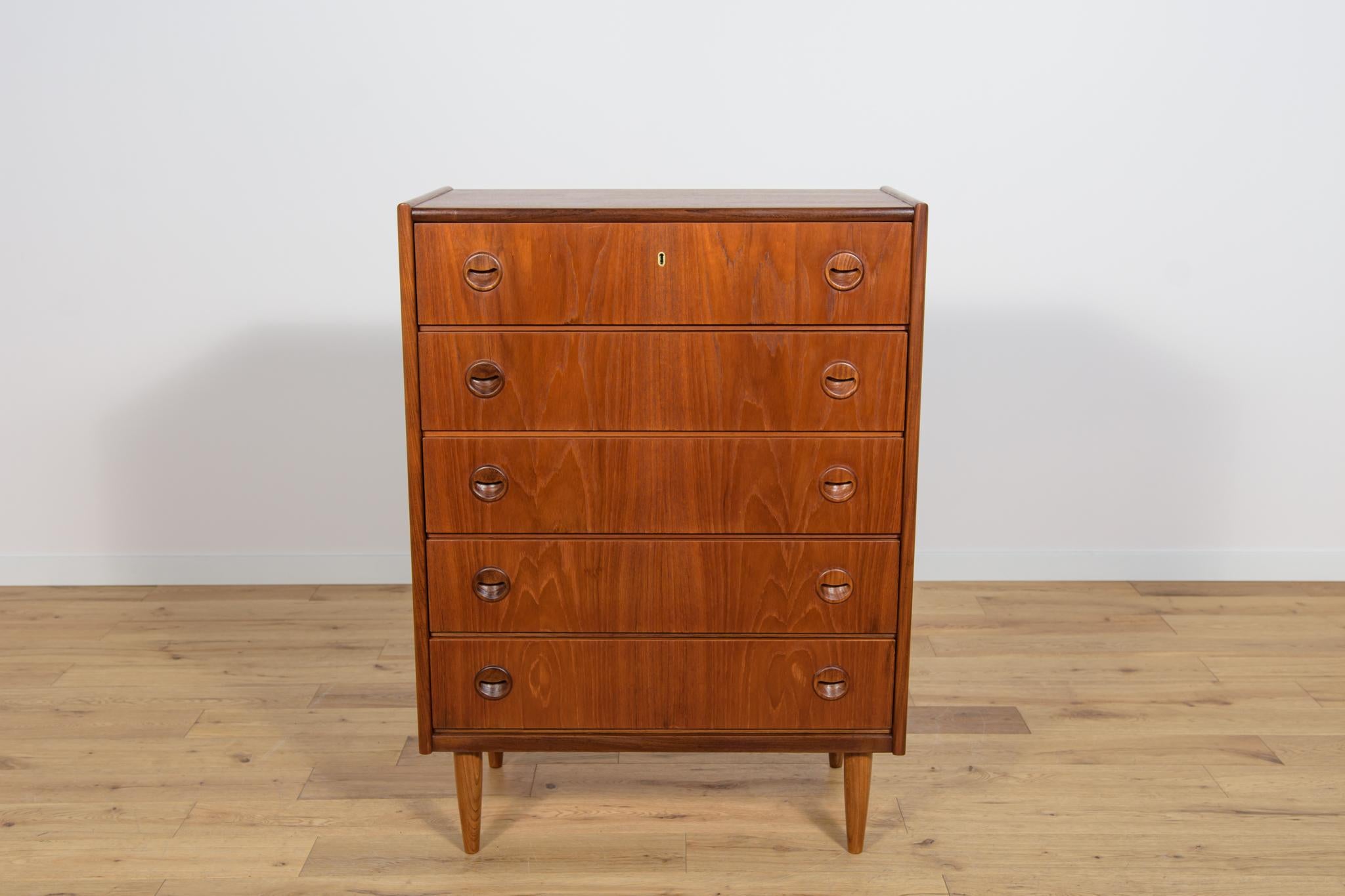 Teak dresser with five drawers made in the 1960s in Denmark. The dresser has contoured handles. The dresser has undergone a comprehensive carpentry renovation. The dresser has been cleaned of the old coating and finished with Danish  Oil.