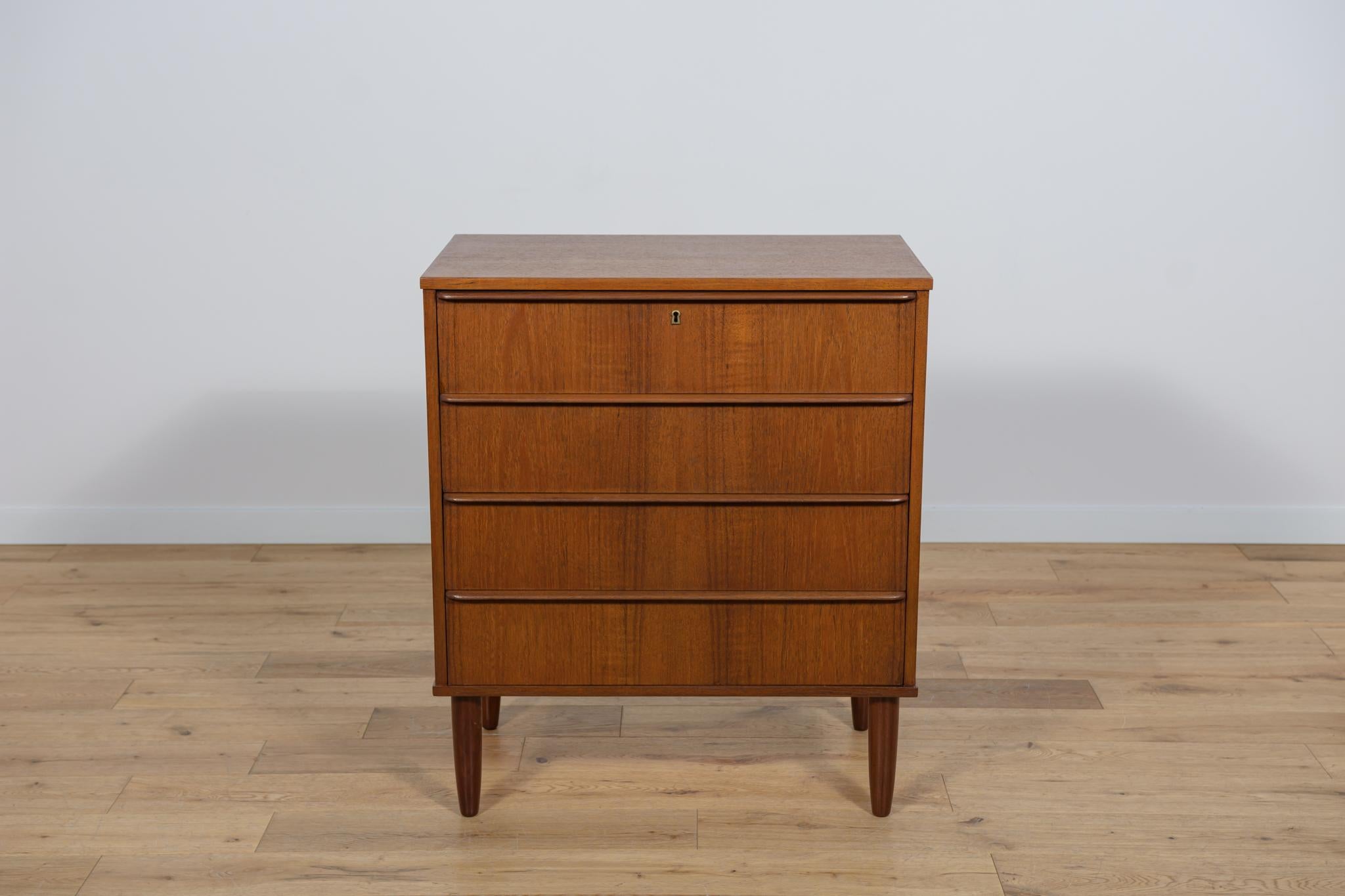 Mid-Century teak dresser made and manufactured during the 1960s in the Denmark. The dresser has profiled handles. The dresser consists of 4 drawers with profiled handles. Teak wood items cleaned from the old surface  and finished with quality Danish