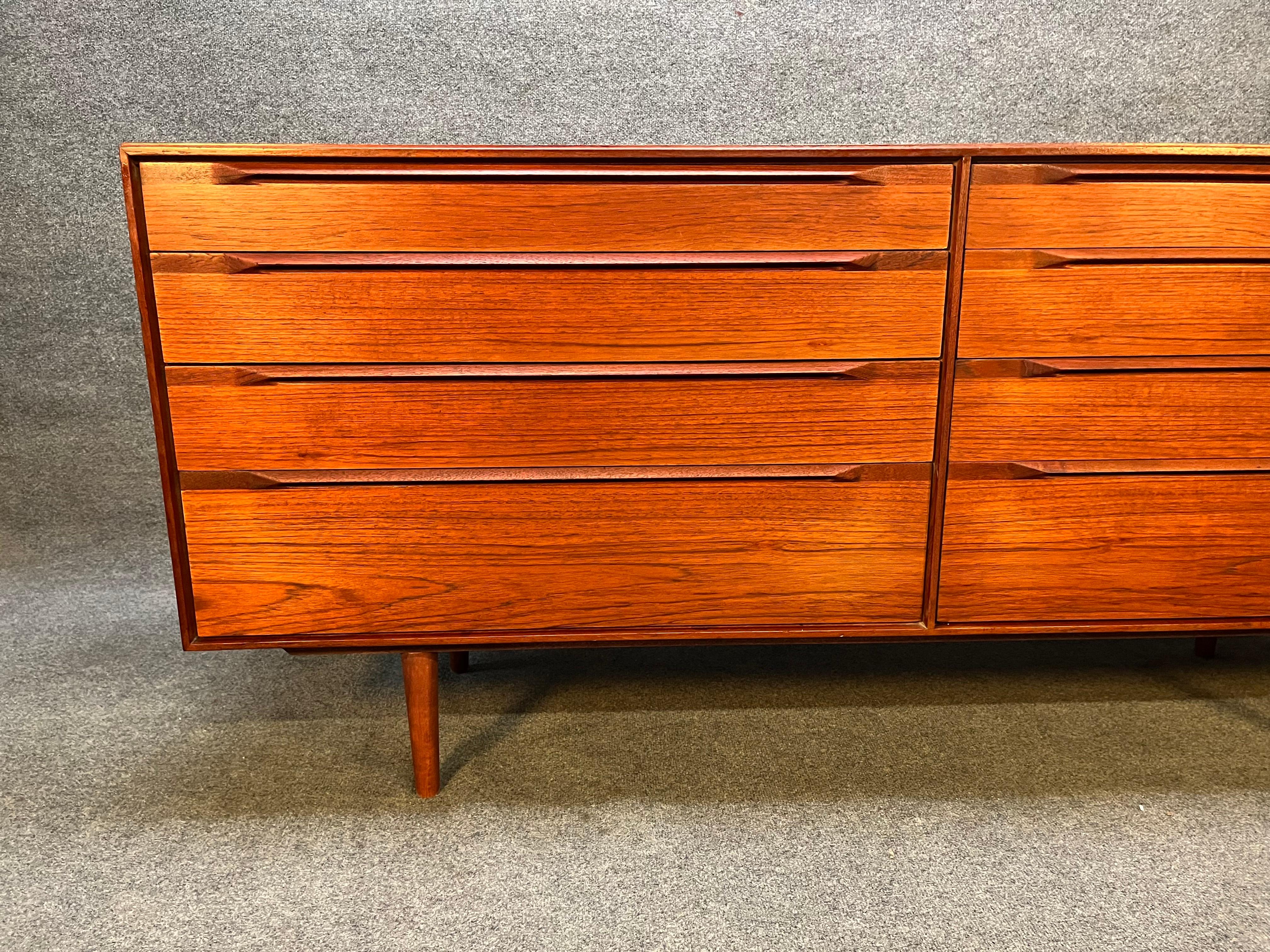 You are viewing a fantastic Danish Teak 8-drawer double dresser, designed by IB Kofod Larsen for Fredericia Mobelfabrik c1960s. This handsome piece features warm teak veneers throughout, six shallower drawers on top, two deeper drawers at bottom