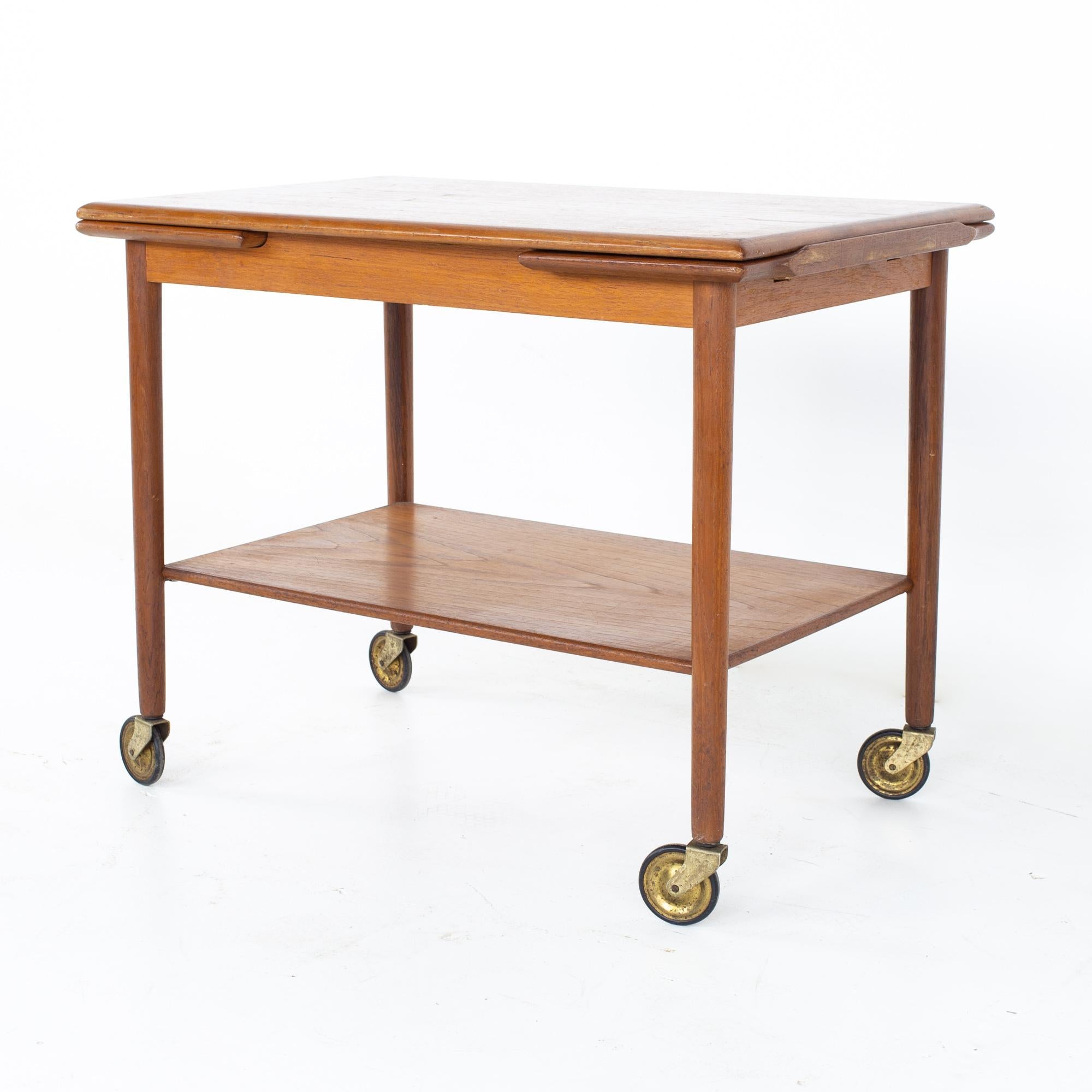 Mid Century Danish teak expanding bar cart
Bar cart measures: 30 wide x 19.25 deep x 23.5 inches high; when extended bar cart is 47.5 inches wide

All pieces of furniture can be had in what we call restored vintage condition. That means the piece
