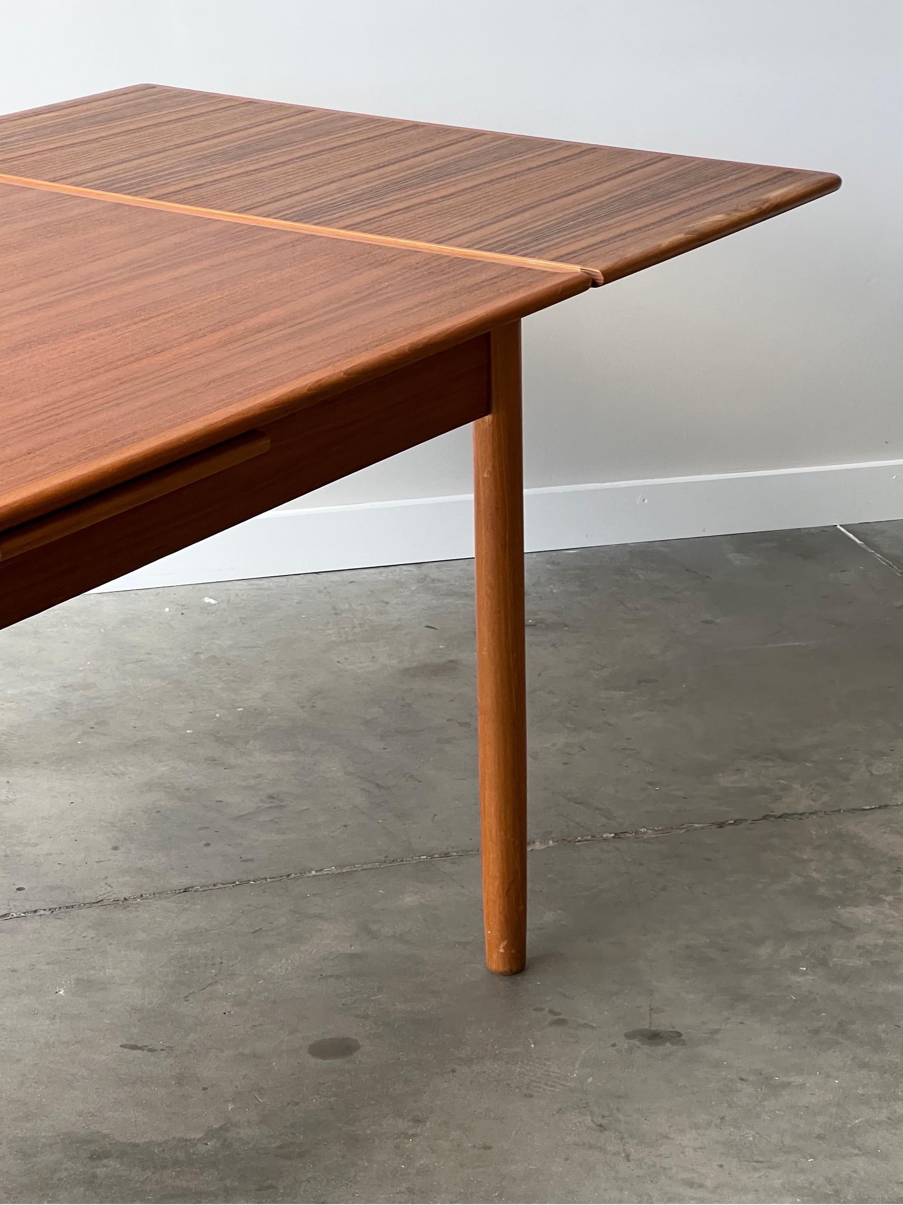 Mid-Century Danish Teak Expanding Dining Table In Good Condition For Sale In Raleigh, NC