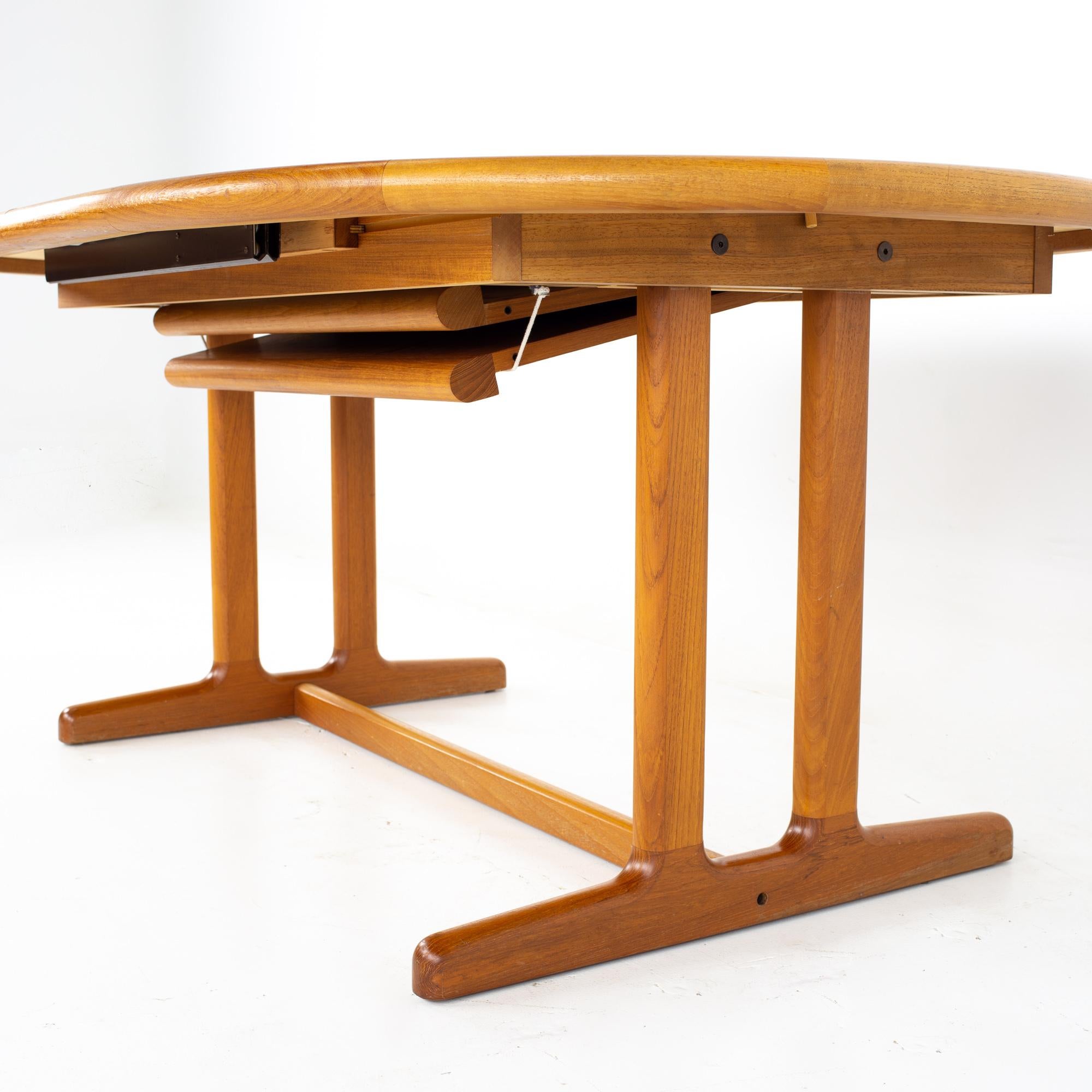 Late 20th Century Mid Century Danish Teak Expanding Hidden Leaf Dining Table
