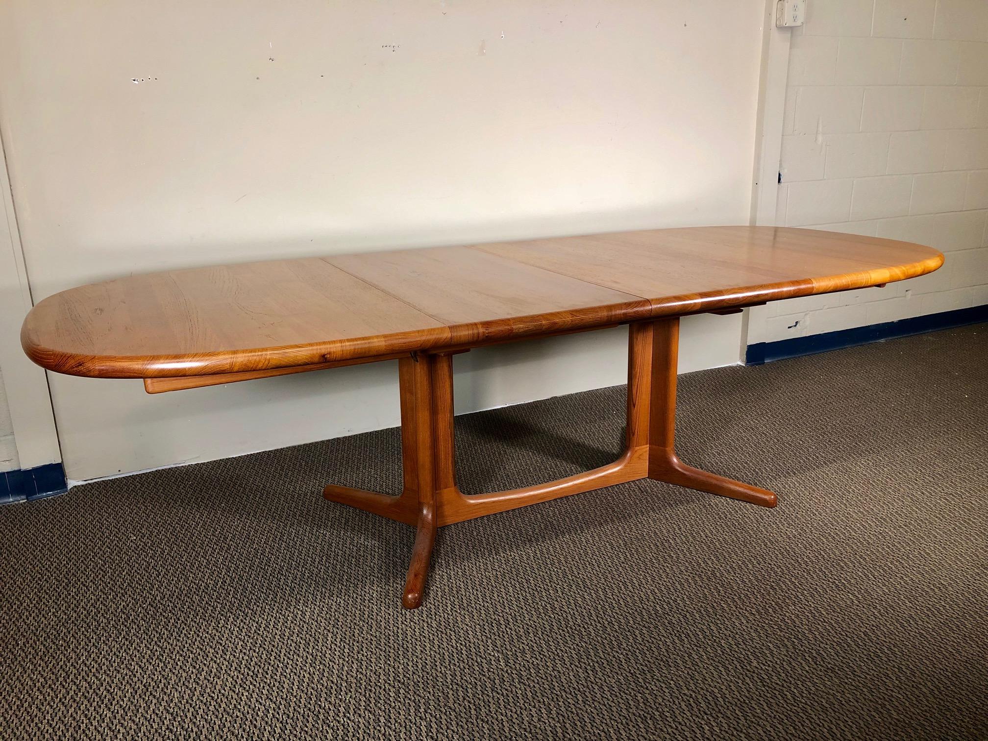 This is a Danish teak dining table with 2 leaves. Made by Glostrup Møbelfabrik. Original label still present. Leaves can be stored inside the table when not in use. The table can be extended with one or with both leaves.

It seats 10 people