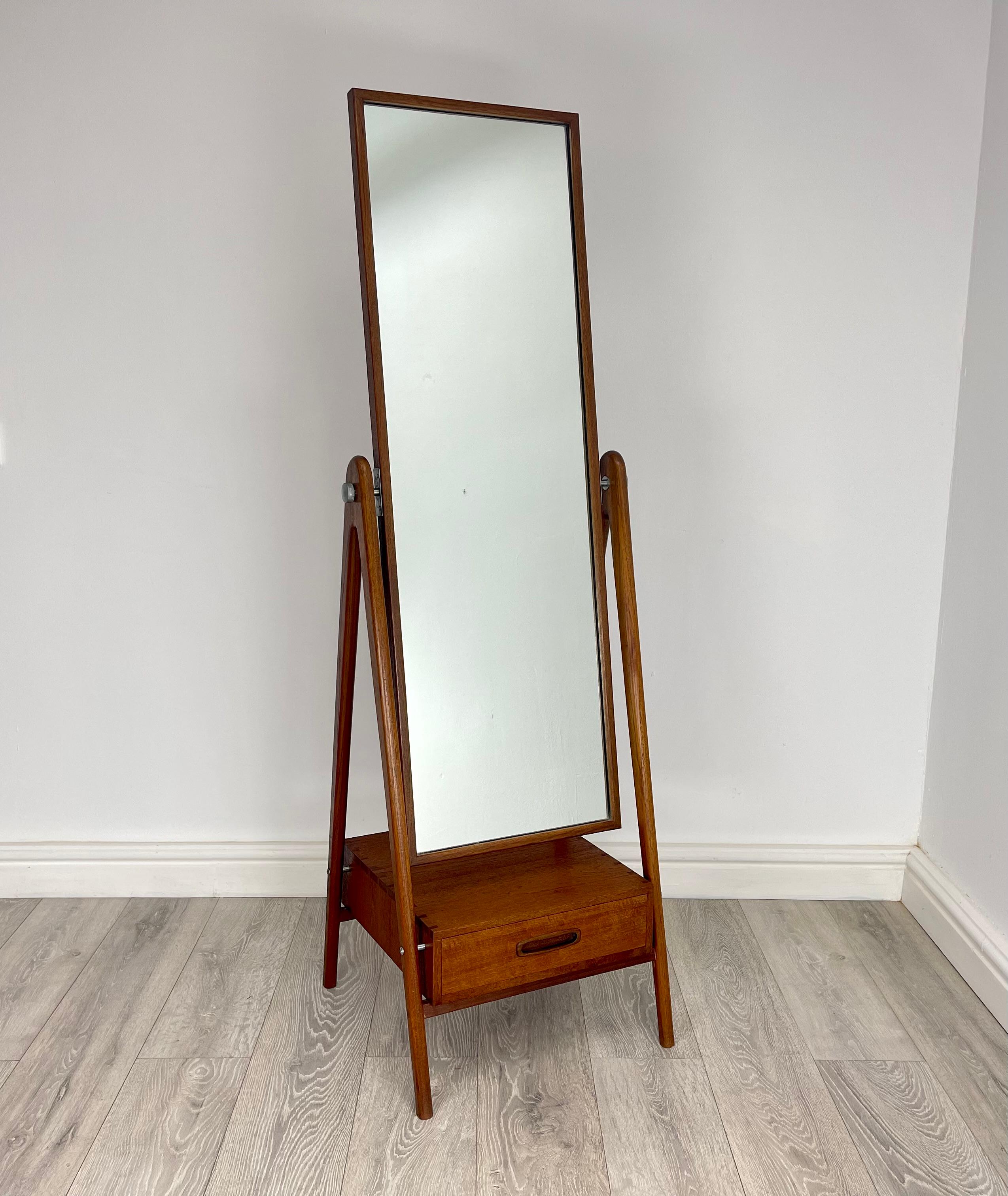 FLOOR MIRROR 
Stunning Midcentury Danish rare teak floor standing  mirror with drawers below  , made from solid teak with dovetail joint to drawer . Stands on elegant v shaped frame , mirror can be fully tilted great quality piece of