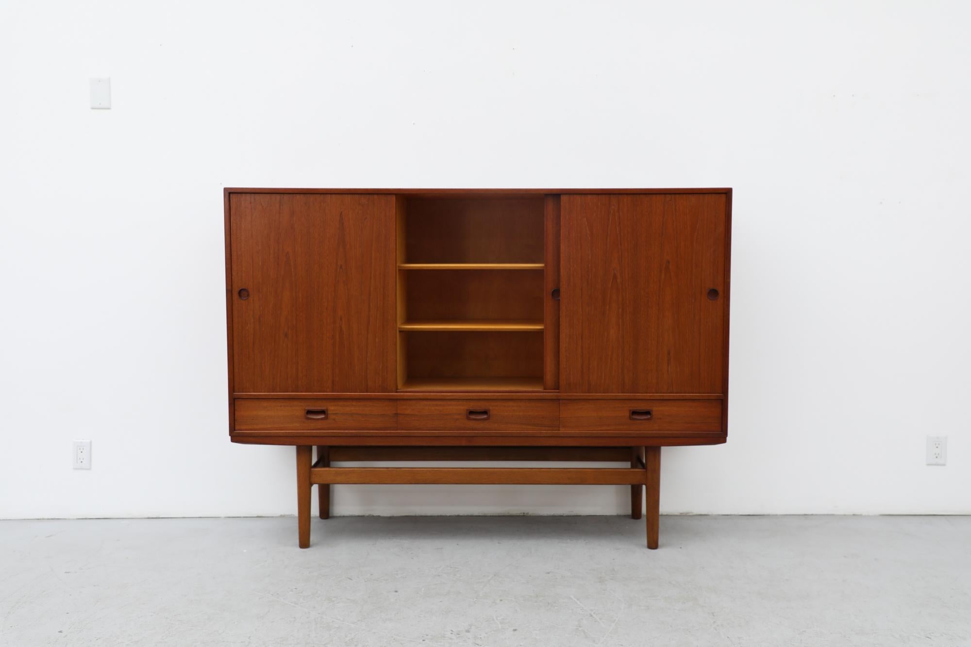 Mid-Century Modern Mid-Century Danish Teak Highboard with Sliding Door Cabinets and Drawers For Sale