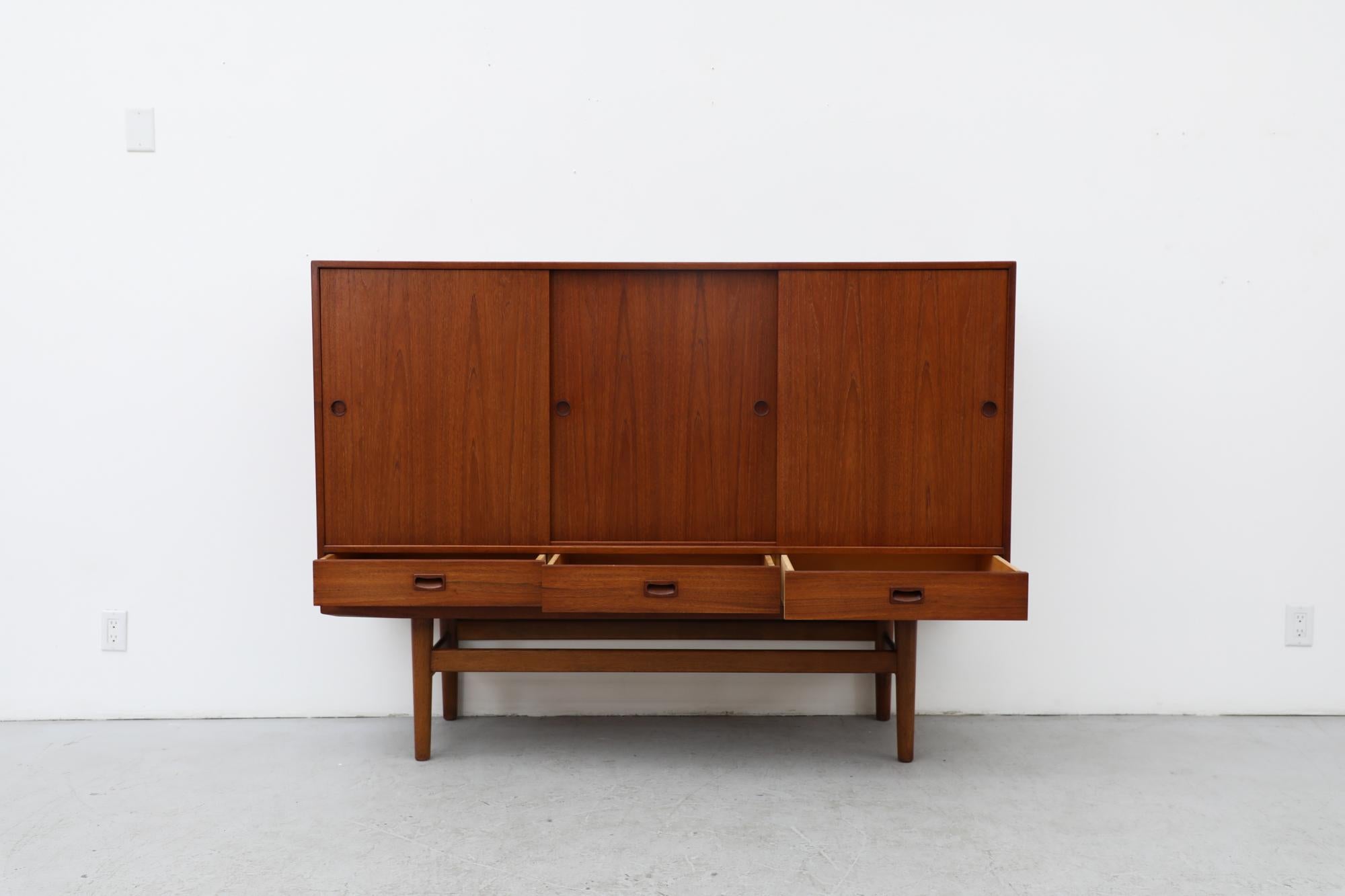 Mid-Century Danish Teak Highboard with Sliding Door Cabinets and Drawers For Sale 1