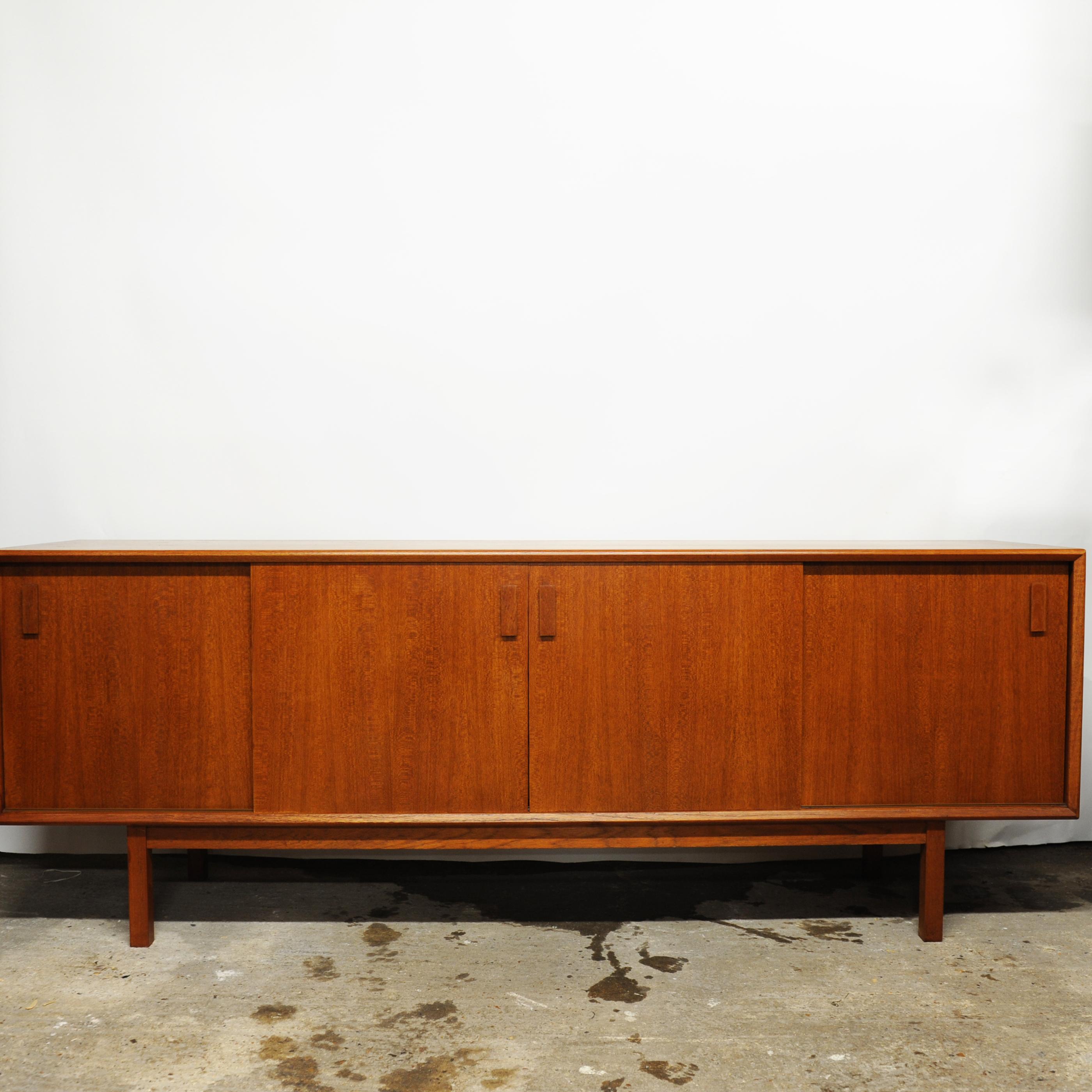 A vintage teak sliding door sideboard with inner decorative drawers and shelves.

Manufacturer - Unknown

Design Period - 1960 to 1969

Country of Manufacture - Denmark

Style - Mid-Century

Detailed Condition - Good with minimal
