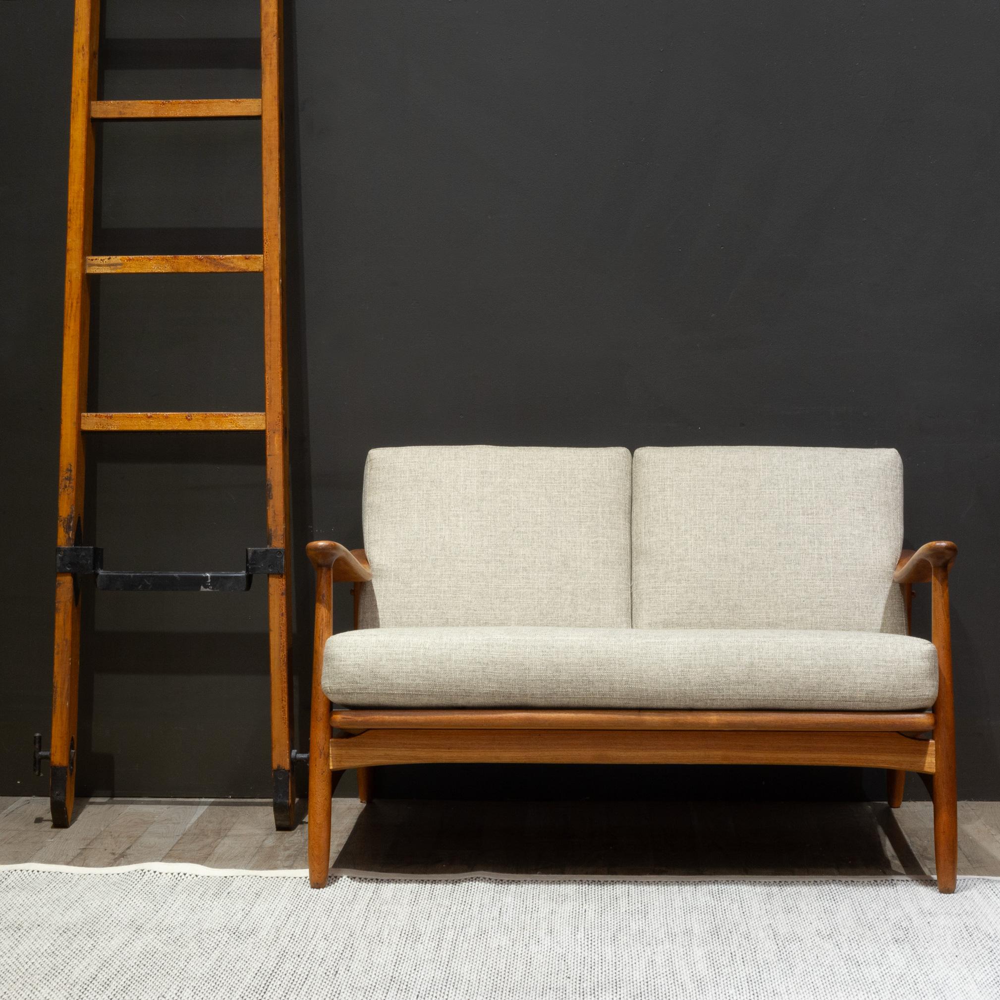 ABOUT

Mid-century solid teak loveseat with woven cane backrest. The seat and back cushions have been recently reupholstered and new thick, foam cushions. 

    CREATOR Torben Strandgaard, Denmark. 
    DATE OF MANUFACTURE c.1950-1959.
    MATERIALS