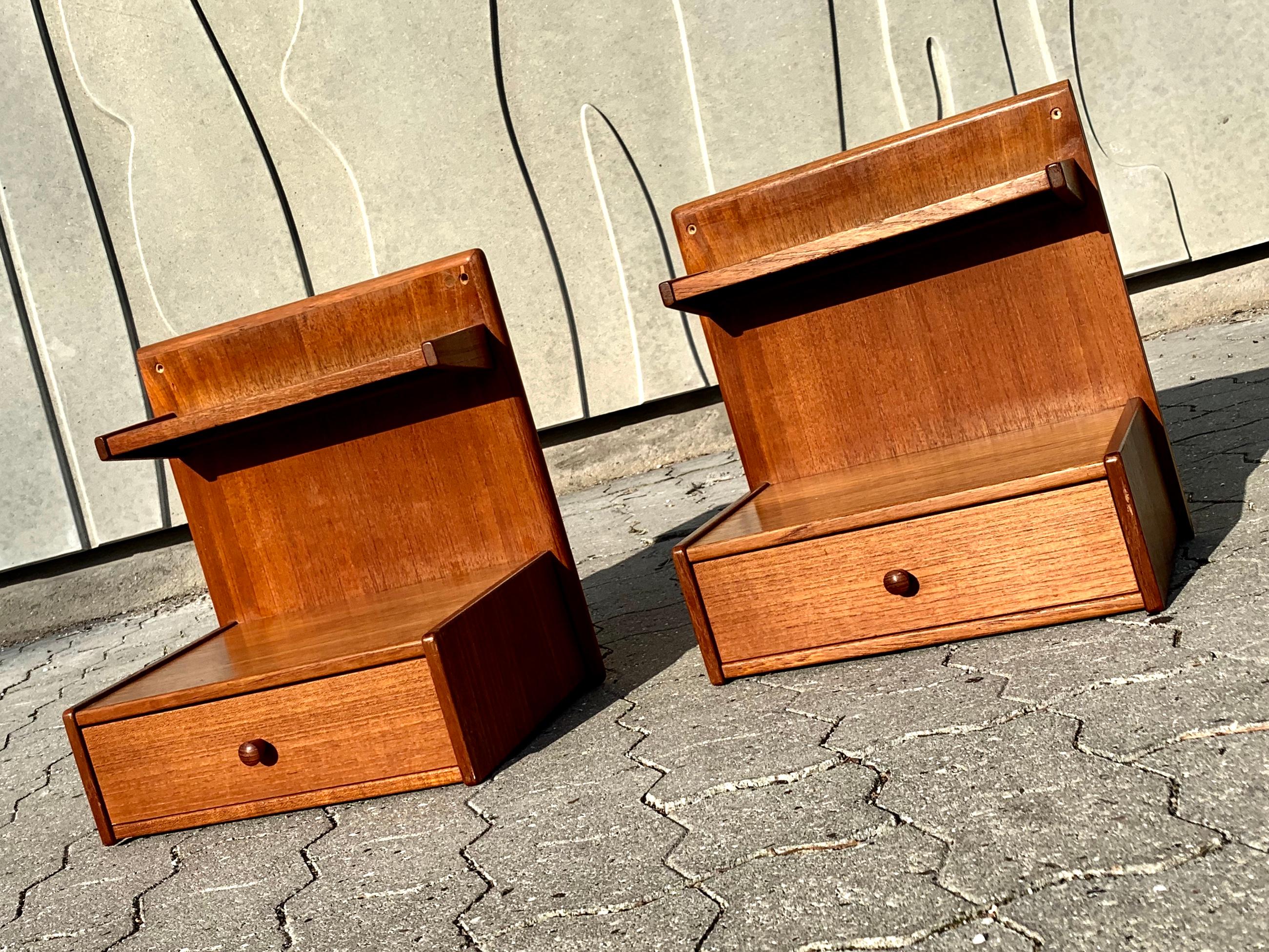 - Beautiful and rare set of hanging nightstands
- Featuring a small black Formica shelf and a drawer
- Designed and produced in Denmark in the 1960s.