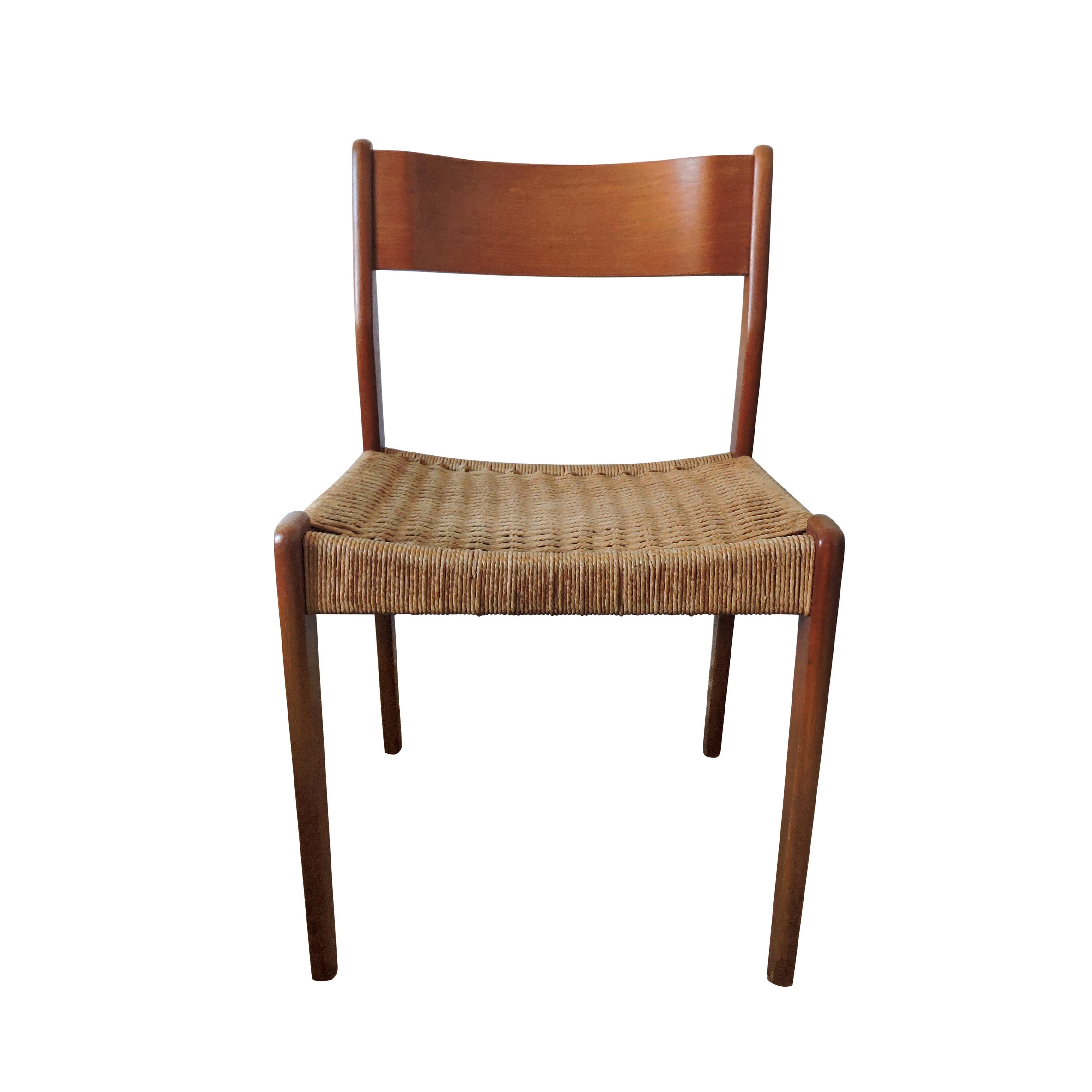 A set of 4 Danish teak and original paper cord dining chairs.
 