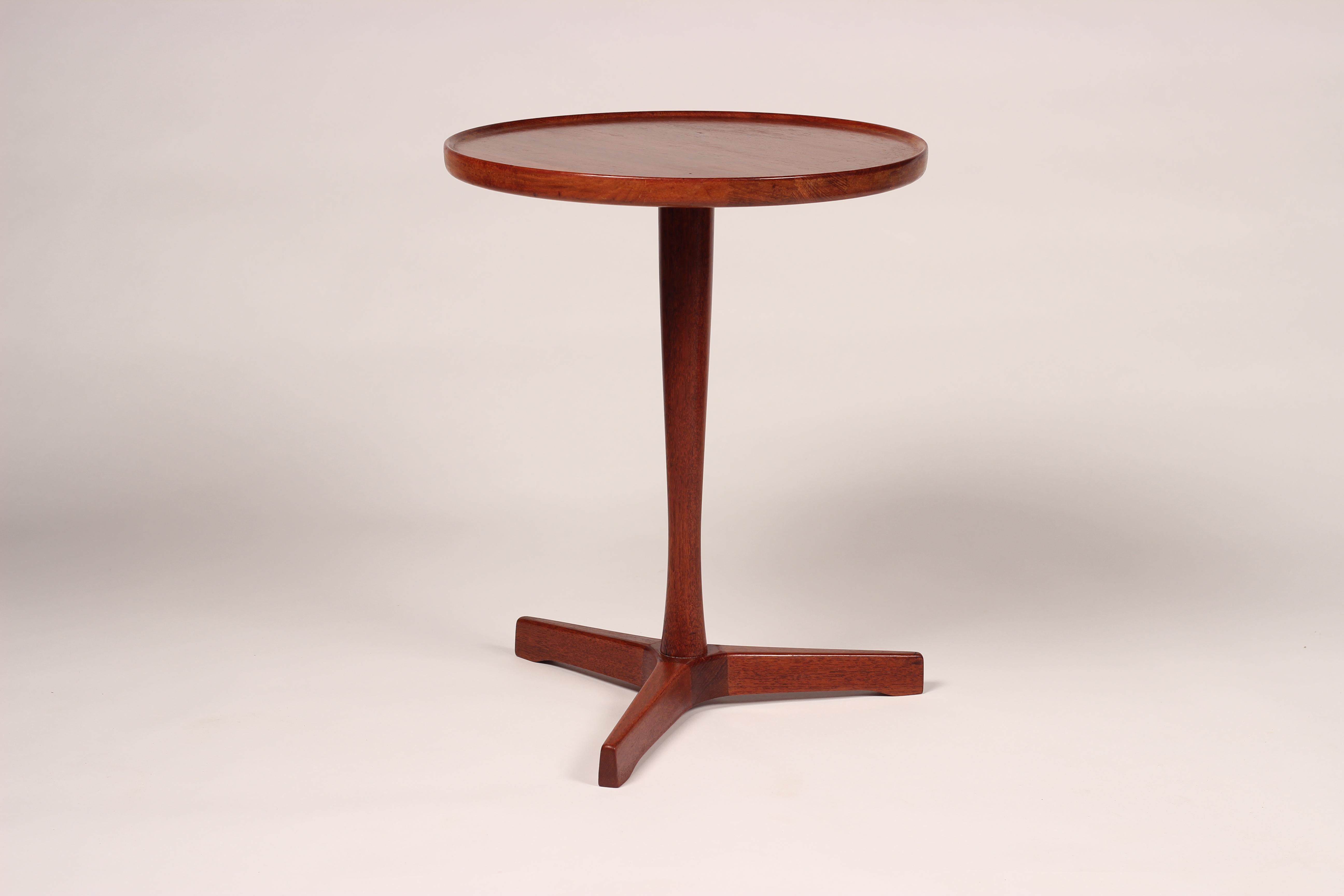 One of Four versatile Mid-Century Modern Danish side tables that we now have currently in store. Professionally restored oiled and waxed. These tables are practical and functional and are simple to ship, with the teak tops, legs and star bases all