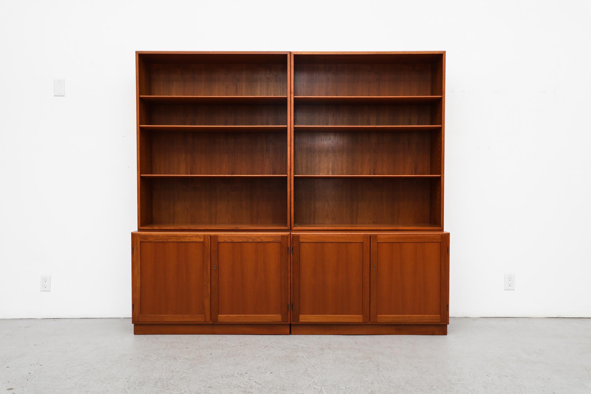 Two 1960s Danish teak bookcases with lower storage cabinets by Søborg Møbelfabrik. Each unit has an upper piece that sits on the wider, lower double door cabinet. Both cabinets have locking doors. One cabinet has a single little felt lined drawer