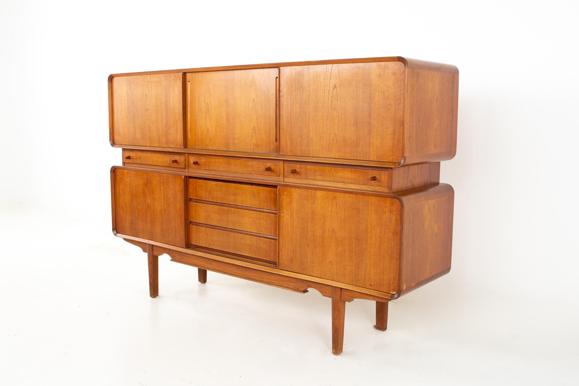 Midcentury Danish teak tall sideboard buffet credenza.
Credenza measures: 70.75 wide x 17.75 deep x 47 inches high

All pieces of furniture can be had in what we call restored vintage condition. That means the piece is restored upon purchase so