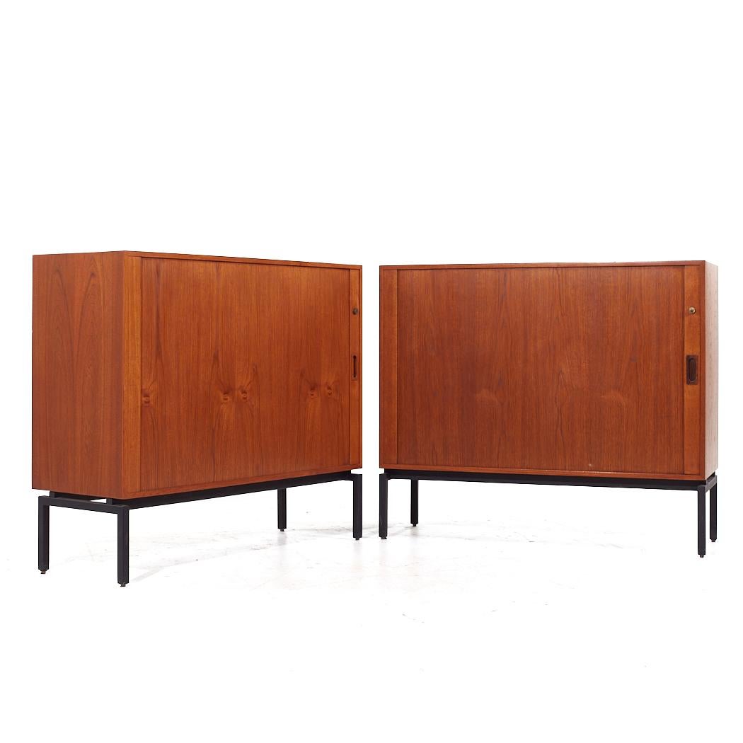 Mid Century Danish Teak Tambour Door Credenza - Pair

Each credenza measures: 43.25 wide x 15.75 deep x 37.25 inches high

All pieces of furniture can be had in what we call restored vintage condition. That means the piece is restored upon purchase