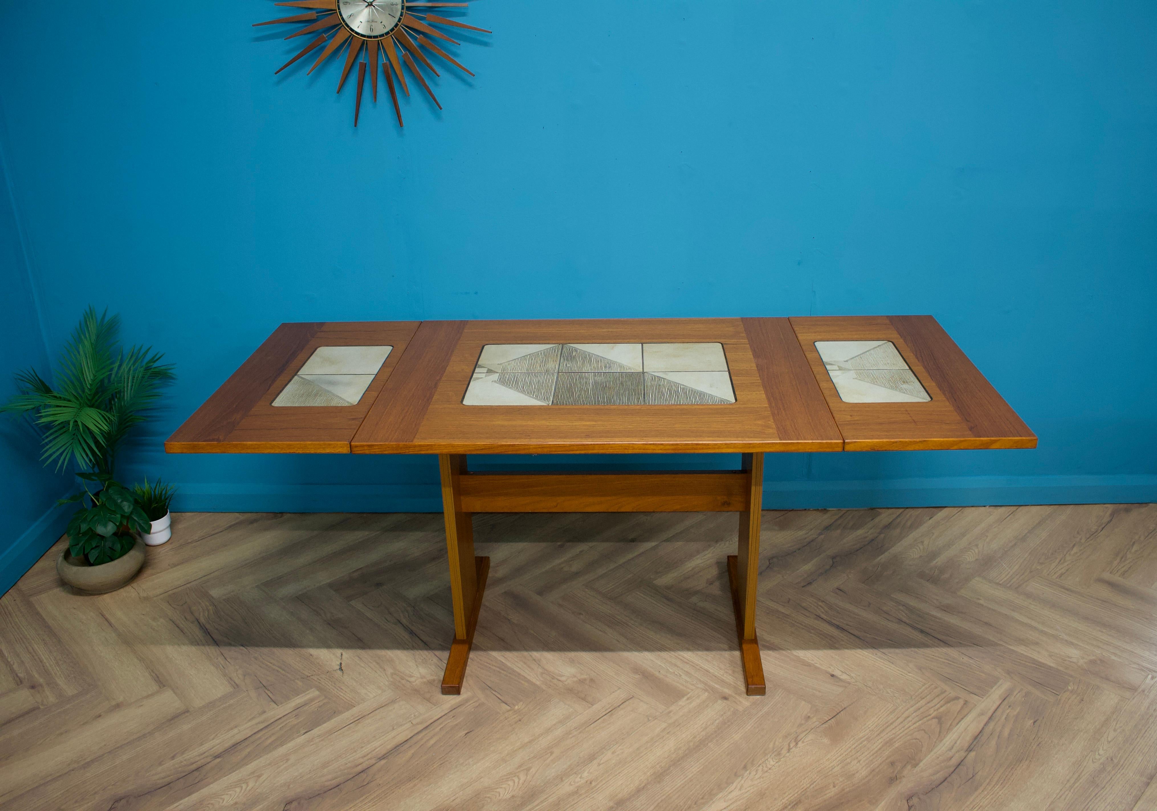 A compact teak extending dining table from Gangso Mobler, made in Denmark during the 1970s (no makers mark present)



The extending leaves are hung either side or can be completely removed



These ceramic tiles, designed by Poul Hermann Poulsen,
