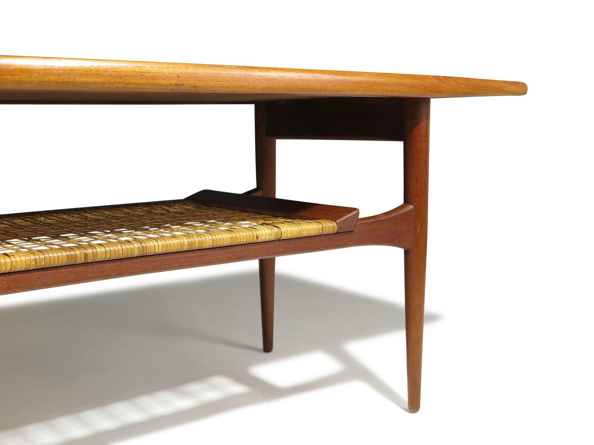 Oiled Mid-Century Danish Teak Two-Tier Coffee Table with Sculpted Edges & Caned Shelf For Sale
