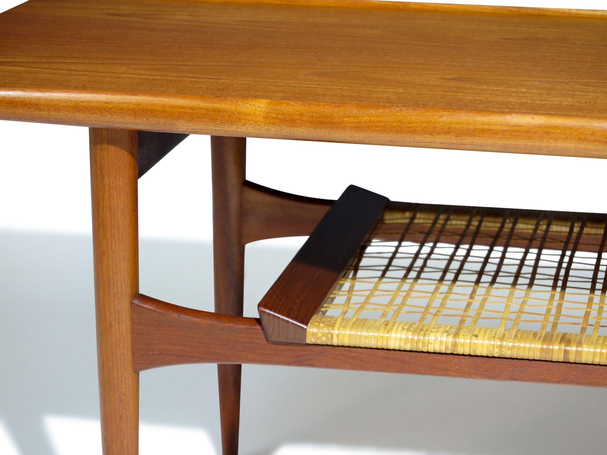 Mid-Century Danish Teak Two-Tier Coffee Table with Sculpted Edges & Caned Shelf In Excellent Condition For Sale In Oakland, CA