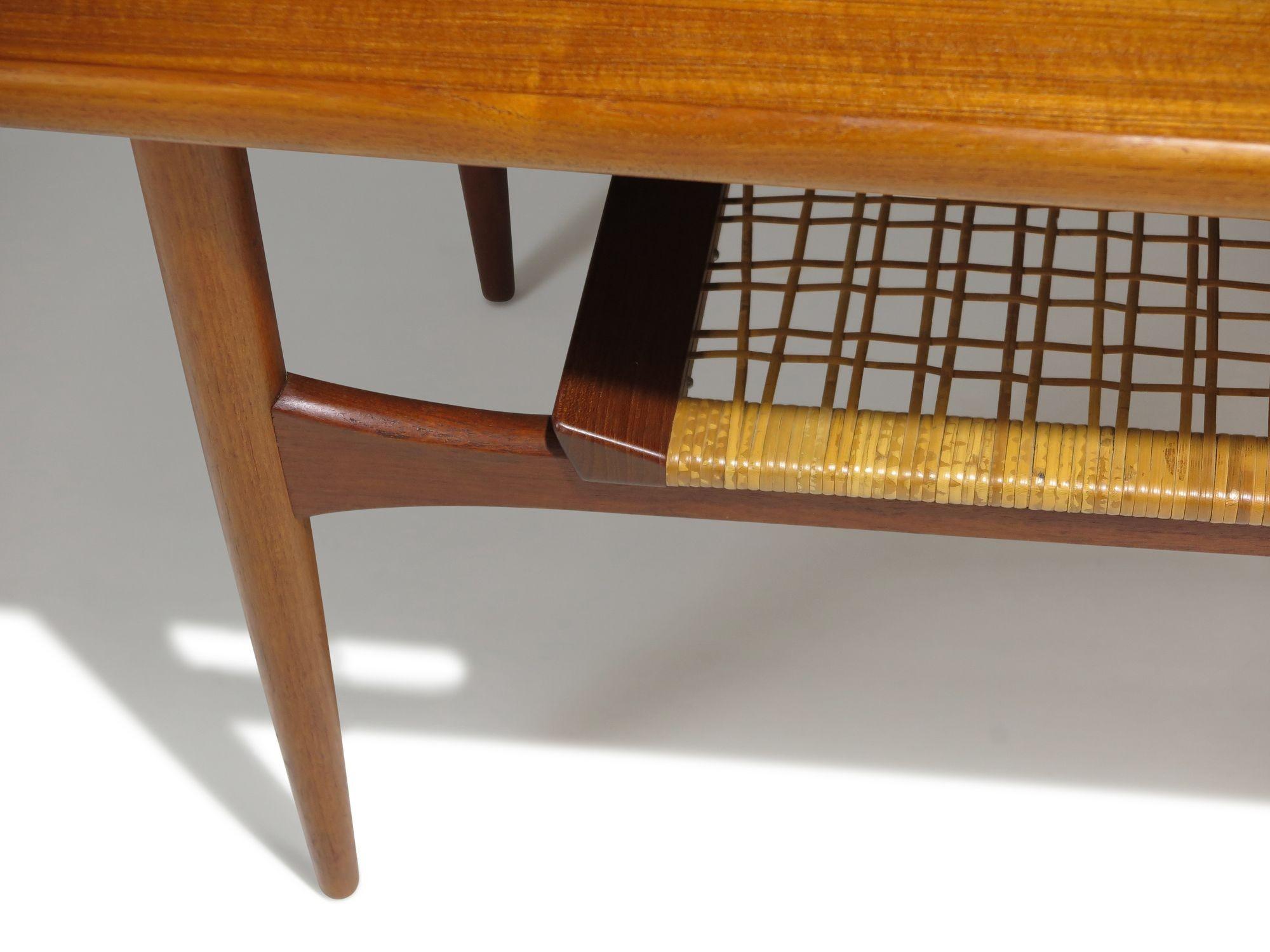 20th Century Mid-Century Danish Teak Two-Tier Coffee Table with Sculpted Edges & Caned Shelf For Sale