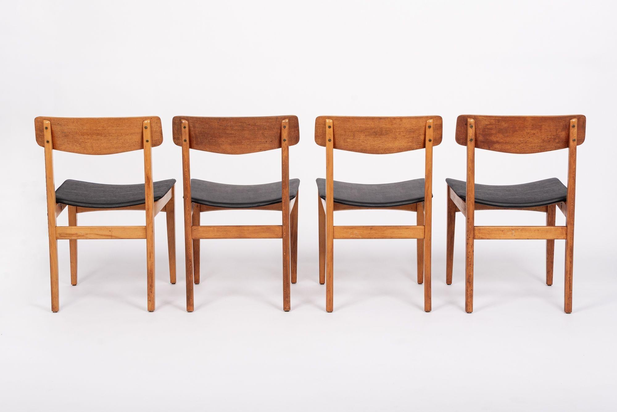 Mid Century Danish Teak Wood & Black Vinyl Dining Chairs In Good Condition For Sale In Detroit, MI