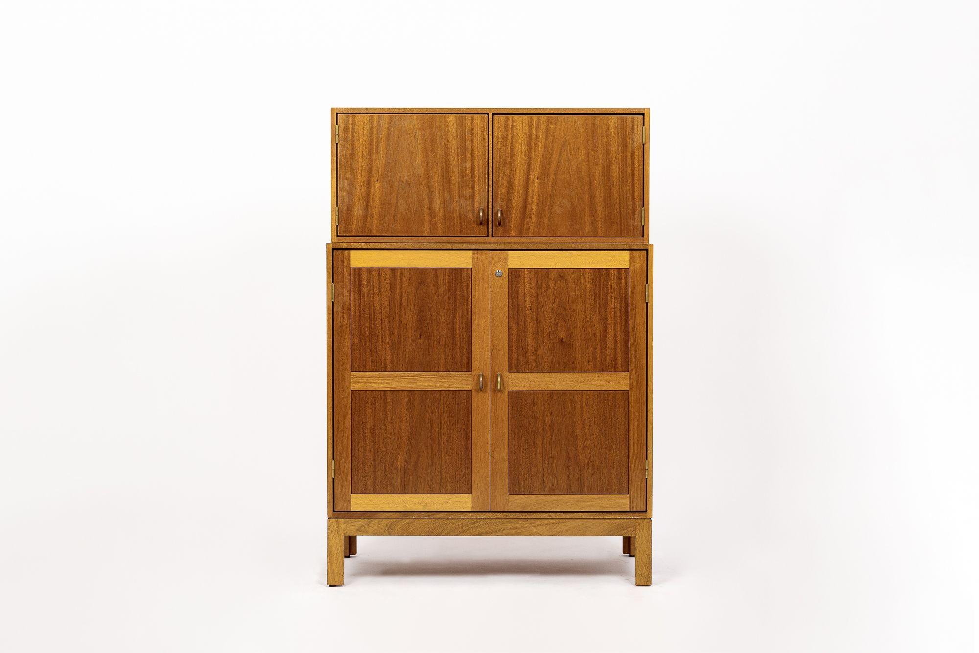 This exceptional vintage mid century Danish modern teak storage cabinet designed by Christian Hvidt for Soborg Mobler was made in Denmark circa 1960. Impeccably crafted from teak wood, the cabinet features multi-tone shades of wood with distinctive