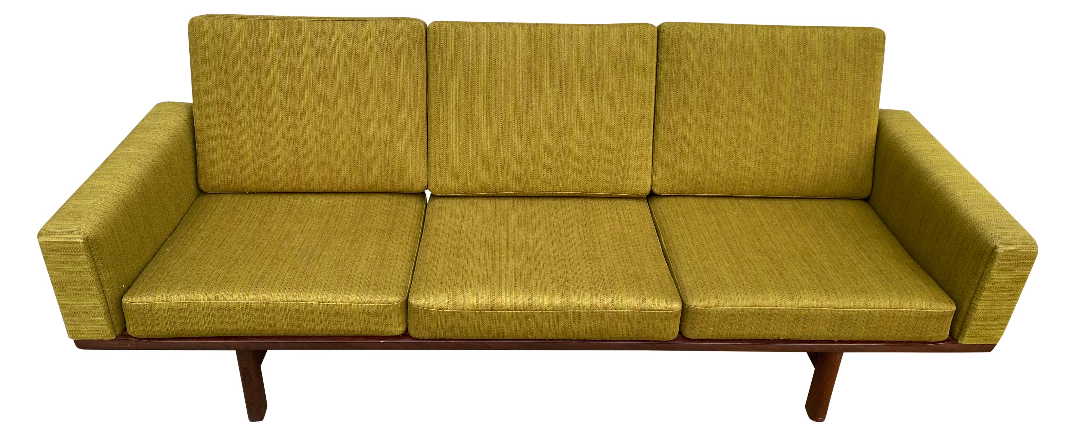 Vintage 1960s Danish three-seat sofa rare model GE-236/3 designed by Hans Wegner for GETAMA Manufacturer solid Teak frame and legs with original patina has original spring loaded cushions with original medium Green woven wool upholstery in vintage