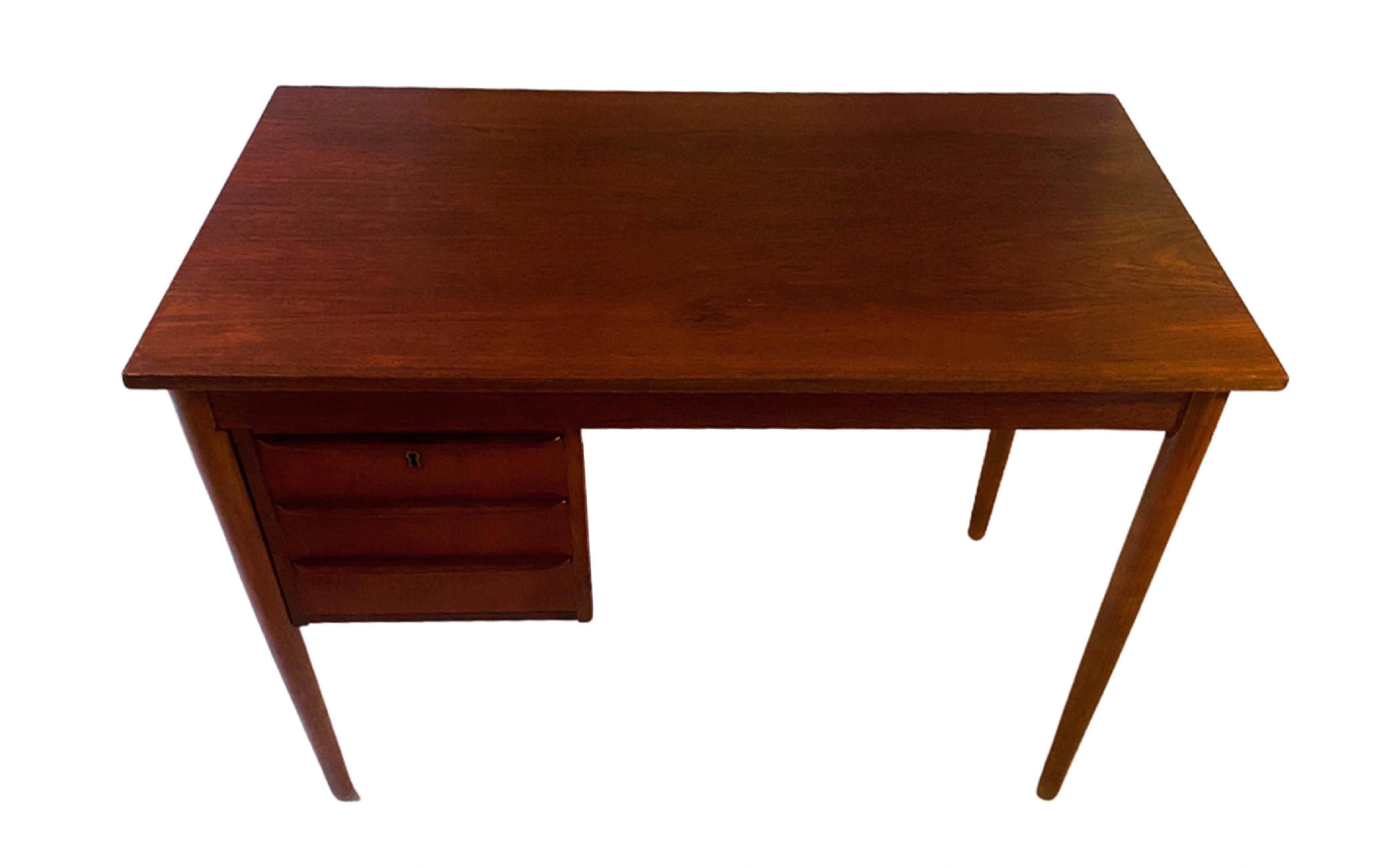 Danish mid-century writing desk in teak with three drawers.

Produced by Danish furniture manufactor.

We have gently restored the table to the absolute highest standard while keeping its original style and appearance.   



NielsenClassics delivers